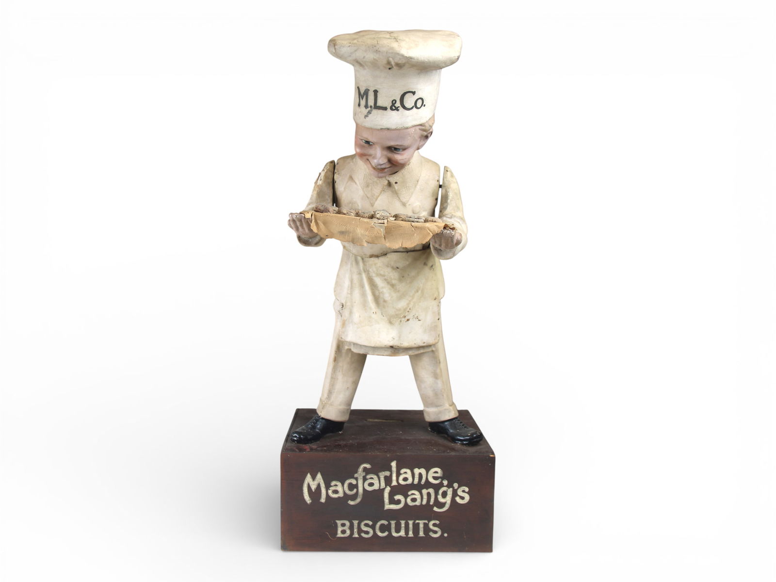Macfarlane Lang's Biscuits Advertising Figure: Large-scale advertising figure depicting a baker wearing a chef's hat and apron, shown presenting a tray of biscuits. The figure appears to be constructed of composition or papier-mache with applied