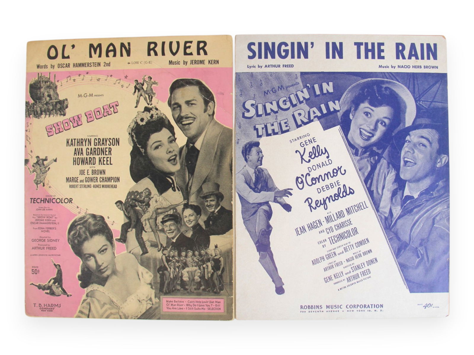 Movie Ephemera Lot, Ads, Sheet Music, Lobby Cards: Lot consists of (2) portfolio books containing many full page ads for well known films from the 1940-60's, 10 pieces of sheet music, 6 lobby cards, Godfather Part II press book sections, and
