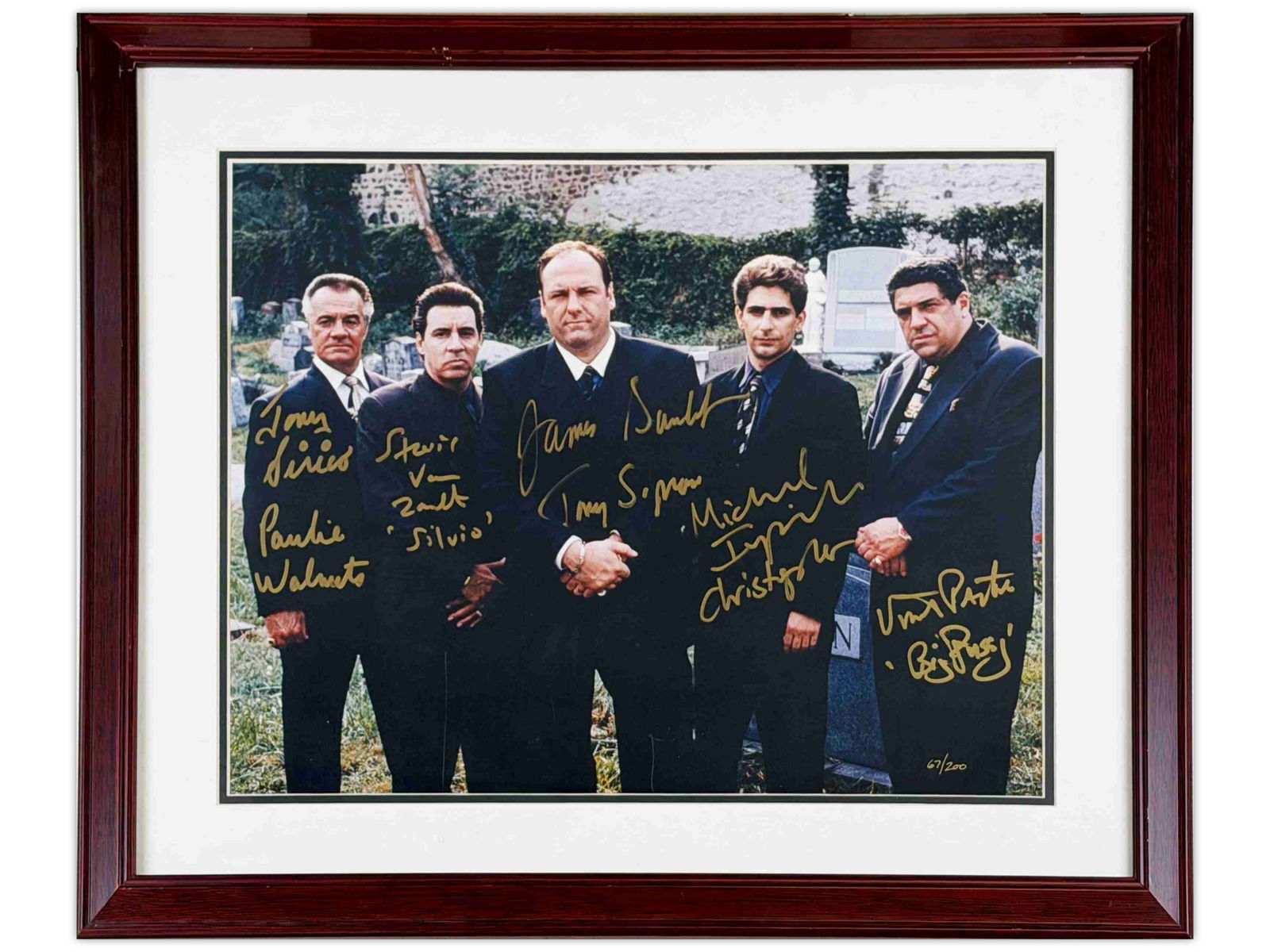 The Sopranos Cast Signed Limited Edition Photo: Framed limited edition color photograph featuring cast members from the acclaimed HBO television series The Sopranos. The photograph is signed in gold marker by James Gandolfini, Vincent Pastore, Tony