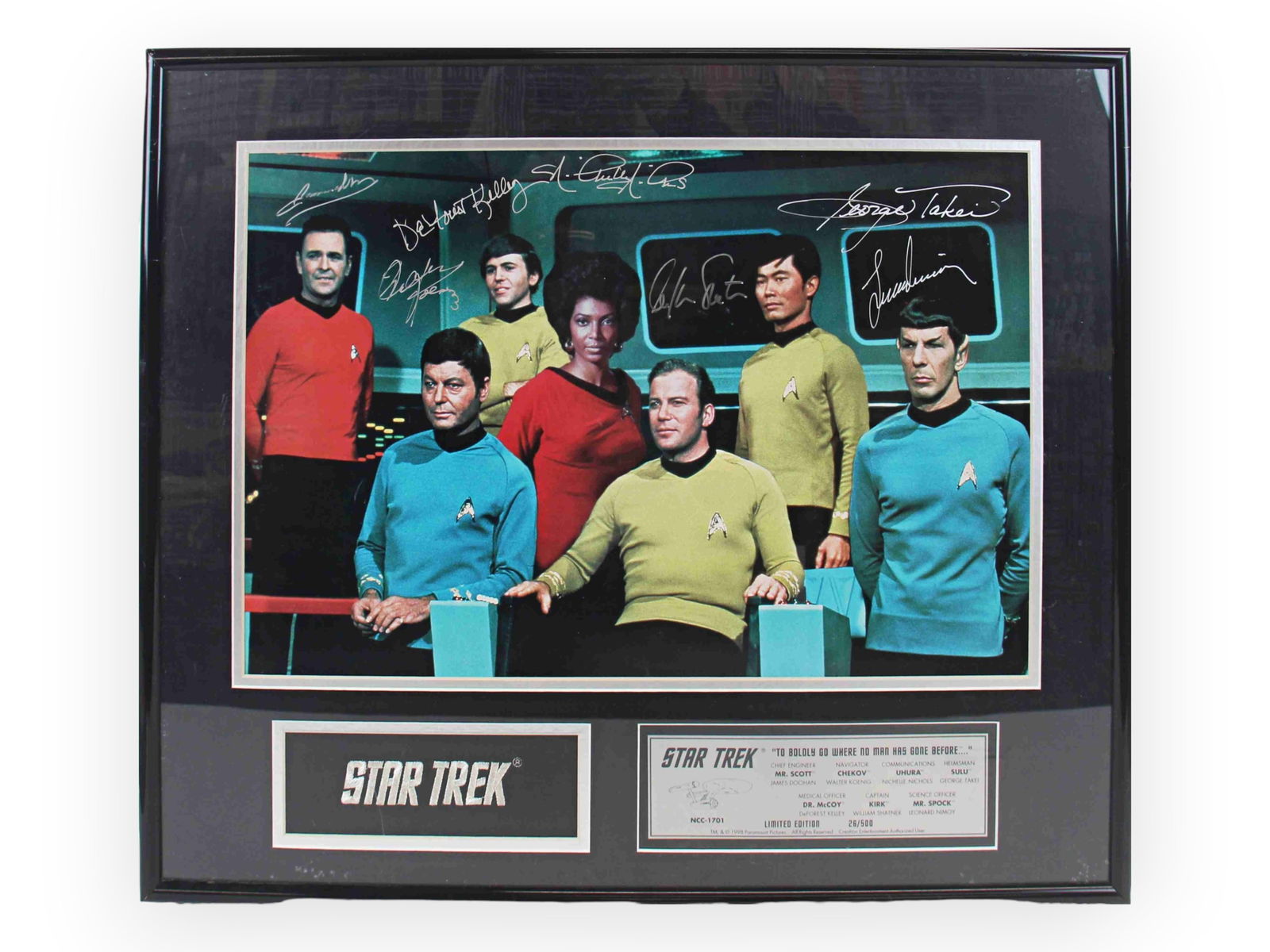 Star Trek Original Series Cast Signed Photo: Framed Star Trek original series cast photograph, signed by the principal cast members. Signatures include James Doohan (Scotty), Walter Koenig (Chekov), Nichelle Nichols (Uhura), George Takei