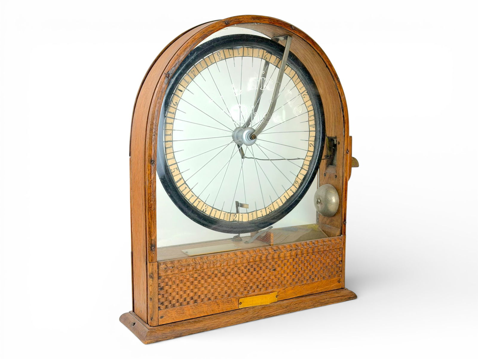 5 Cent Waddel Bicycle Wheel Cigar Trade Stimulator: Circa 1893-1901, Waddel W.W. Works, "Bicycle Wheel" Cigar Trade Stimulator. Countertop stimulator housed in a curved wooden cabinet with original front etched glass. Bottom edge has original