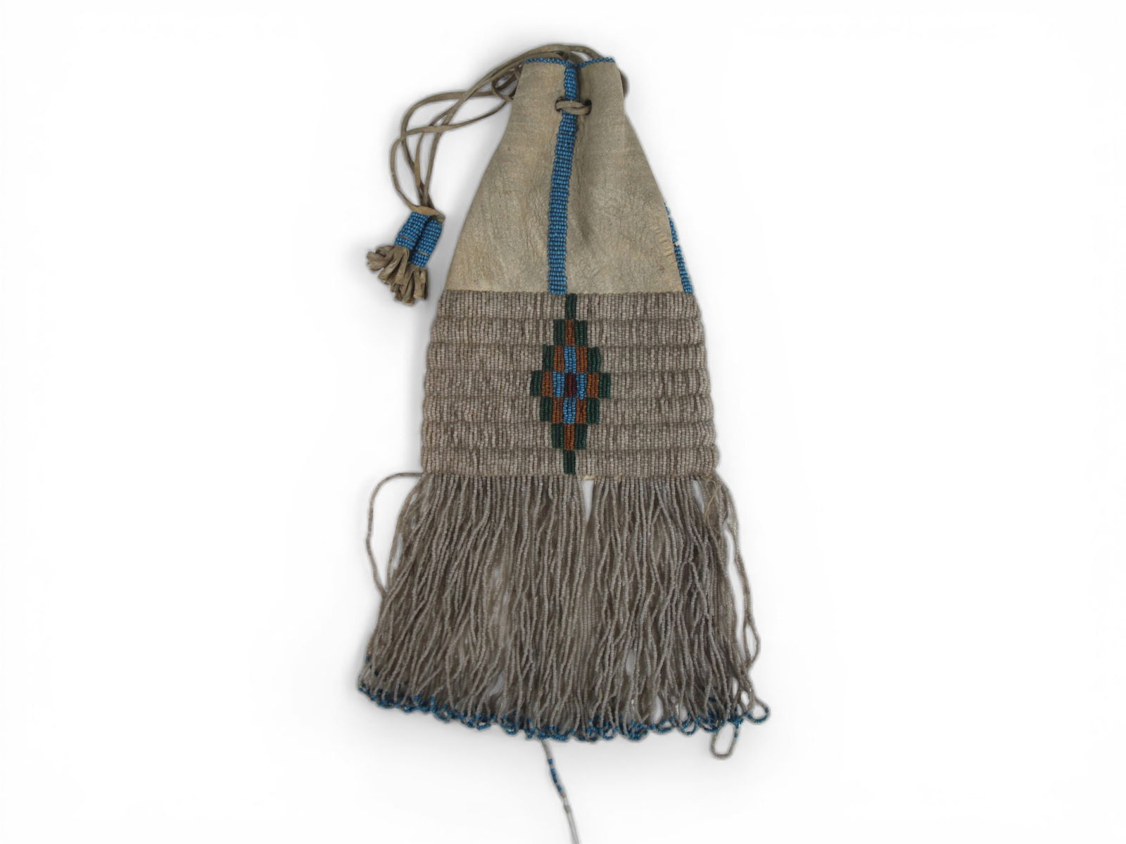 Blackfoot Beaded Hide Bag, Circa 1910: Early 20th century Blackfoot beaded hide bag, measuring approximately 13 inches in overall length including fringe. Front panel featuring a central geometric motif executed in beads in shades of