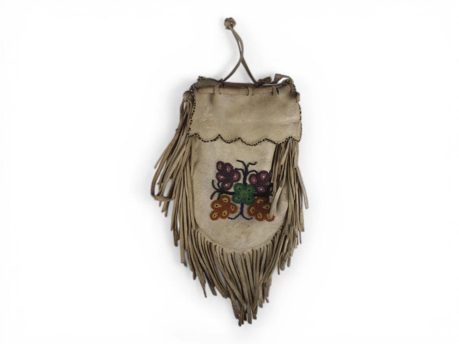 Chippewa Beaded Hide Tobacco Bag, Circa 1800's: Late 19th century Chippewa beaded hide tobacco bag, circa 1800's. The bag is constructed from soft, tanned hide and features a fully beaded lower panel on both sides decorated with a bold central