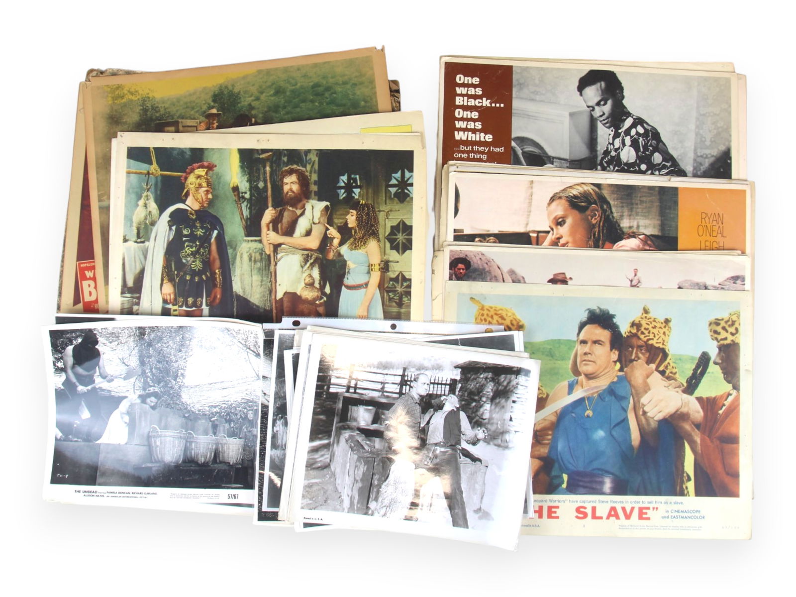 Movie Stills and Lobby Card Lot: Lot consists of an assortment of approx. 30 movie stills/photos, with some originals that are stamped on the verso, others maybe later copies. Also includes a small group of mixed lobby cards (no