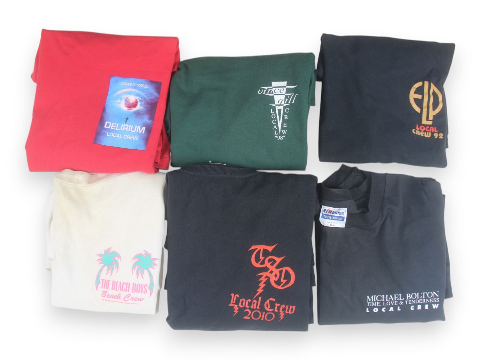 (20) Popular Musical Acts Crew T-Shirts: (20) Popular Musical Acts Local Crew T-Shirts, given to the local stage crew at concerts; 1) ELP (Emerson Lake & Palmer), 1992; 2) Vince Gill, 1998; 3) Cirque du Soleil, Delerium, 4) Beach Boys Beach