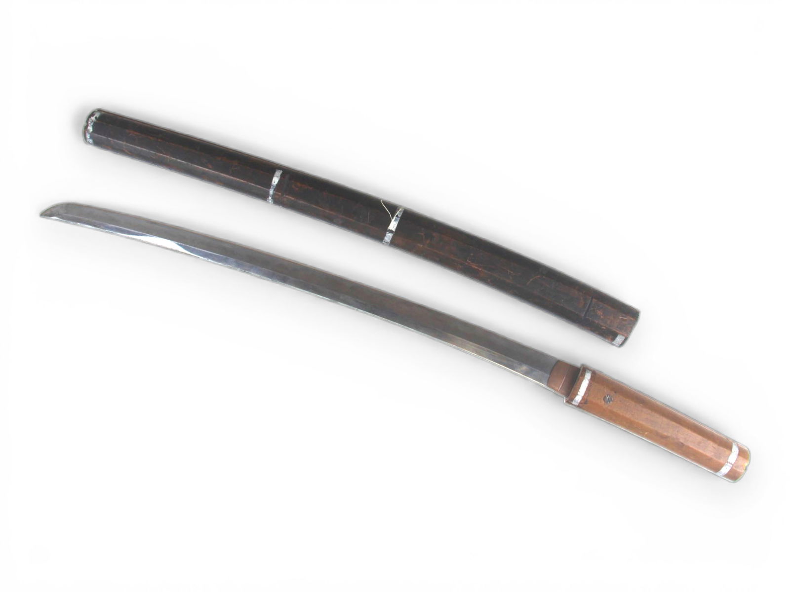 Japanese Pre-WWII Sword: Japanese pre-WWII Wakizashi sword. Unsigned. In Shirasaya fitted with screw instead of ped. Shirasaya shows age. Blade approx. 27 1/8'' long (including Tang).Shipping: Weiss Auctions offers