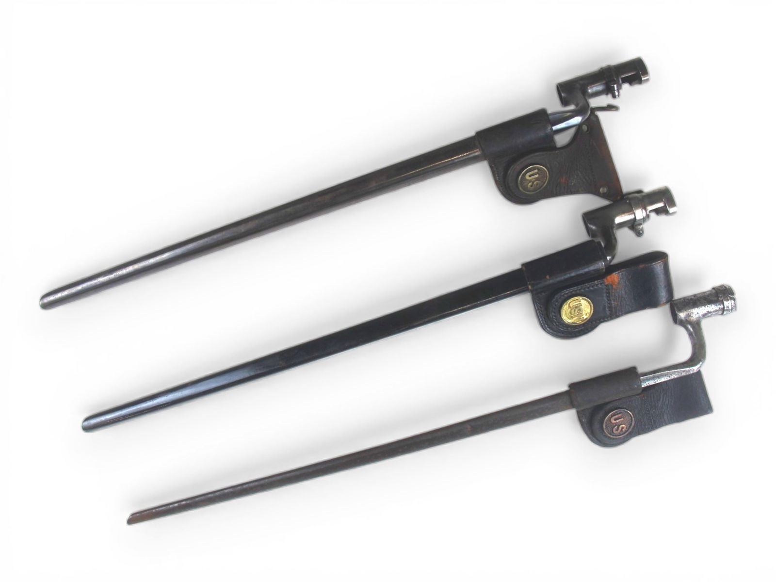 (3) U.S. Socket Bayonets: 3 U.S. Socket bayonets with scabbards. Each approx. 22'' long.Shipping: Weiss Auctions offers full-service, in-house shipping for nearly all items in this auction. For a shipping quote, please