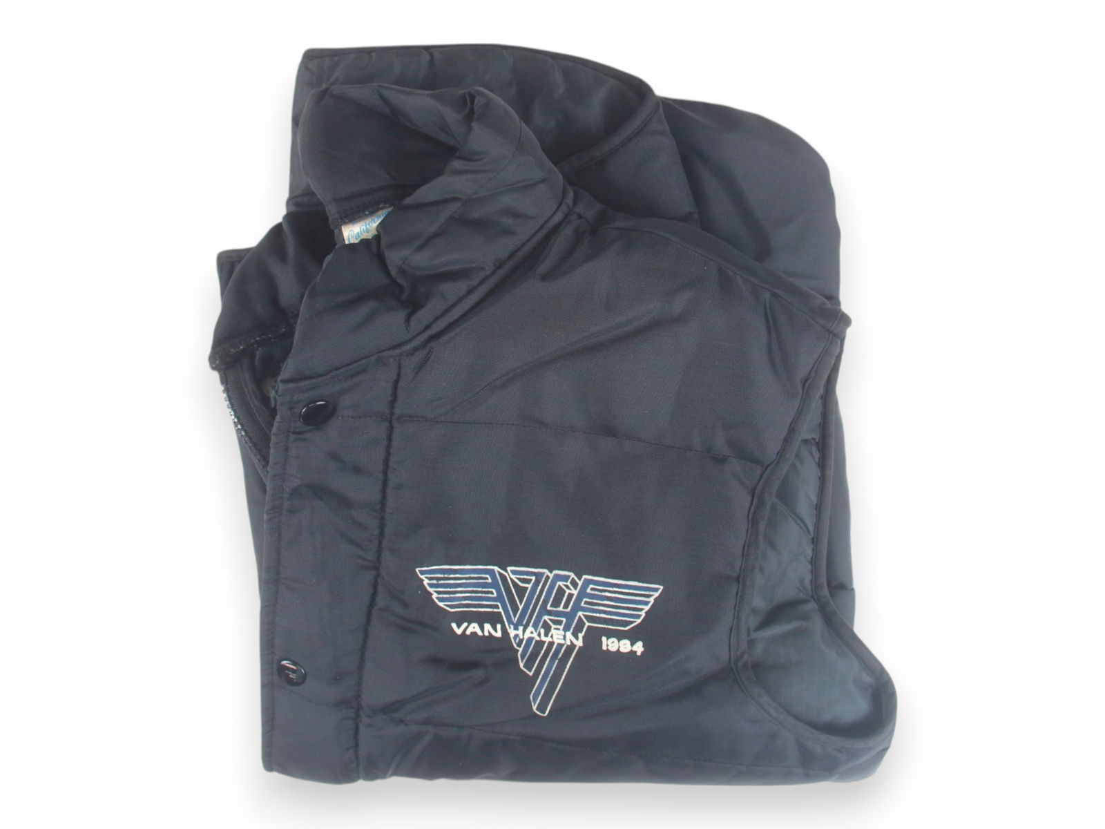 Van Halen 1984 Quilted Tour Vest: Van Halen 1984 Quilted vest, logo printed on front, label "Made in California", size M, from tour assistant Karen Cohen collection Shipping: Weiss Auctions offers full-service, in-house shipping for n
