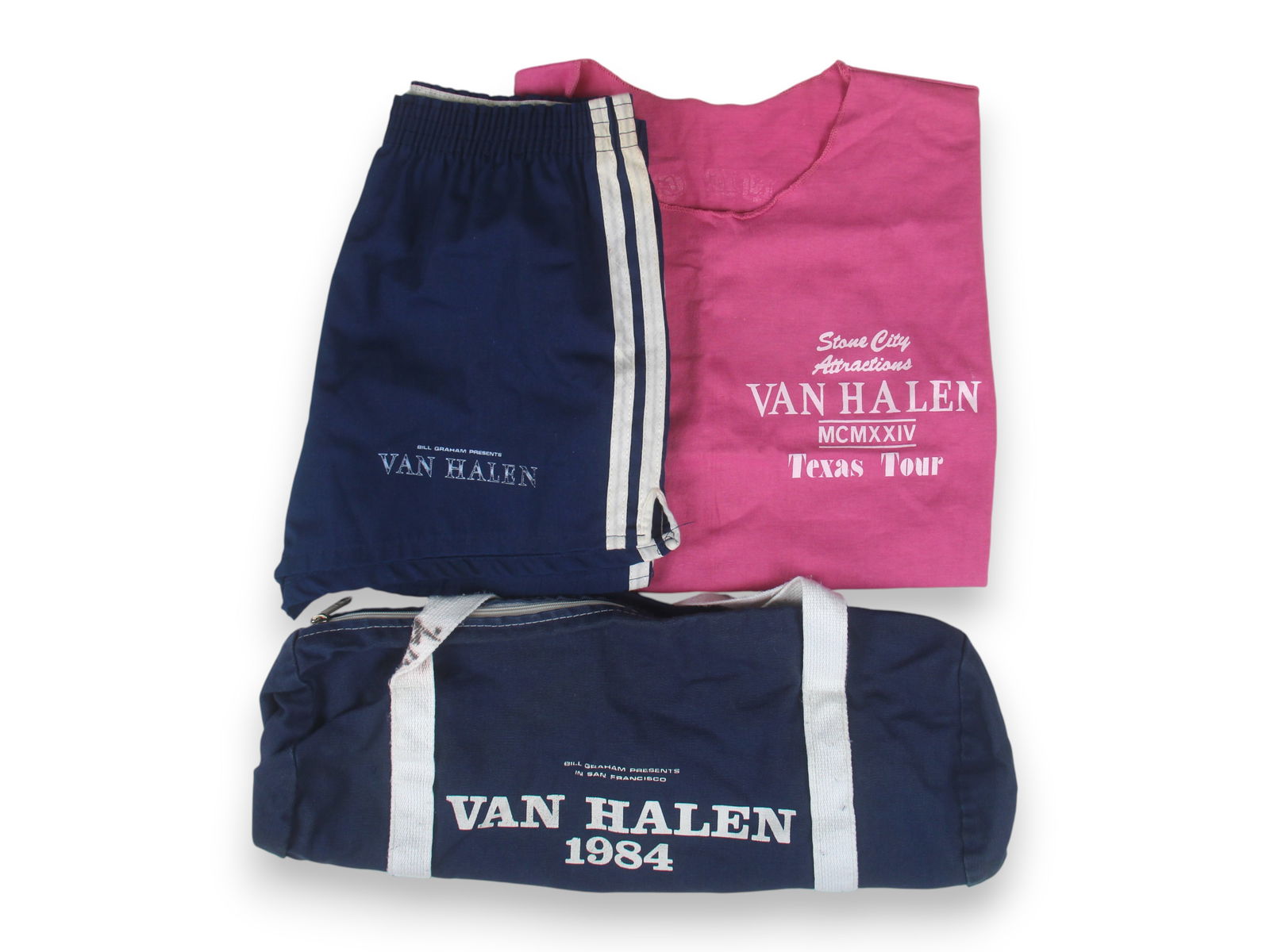 (3) Van Halen 1984 Tour Crew Clothing: Van Halen 1984 Tour Crew Clothing, from tour assistant Karen Cohen collection, 1) Pink T-shirt, "Stone City Attractions" "MCMXXIV Texas Tour" on front, "Stone City Presents Van Halen MCMXXIV",