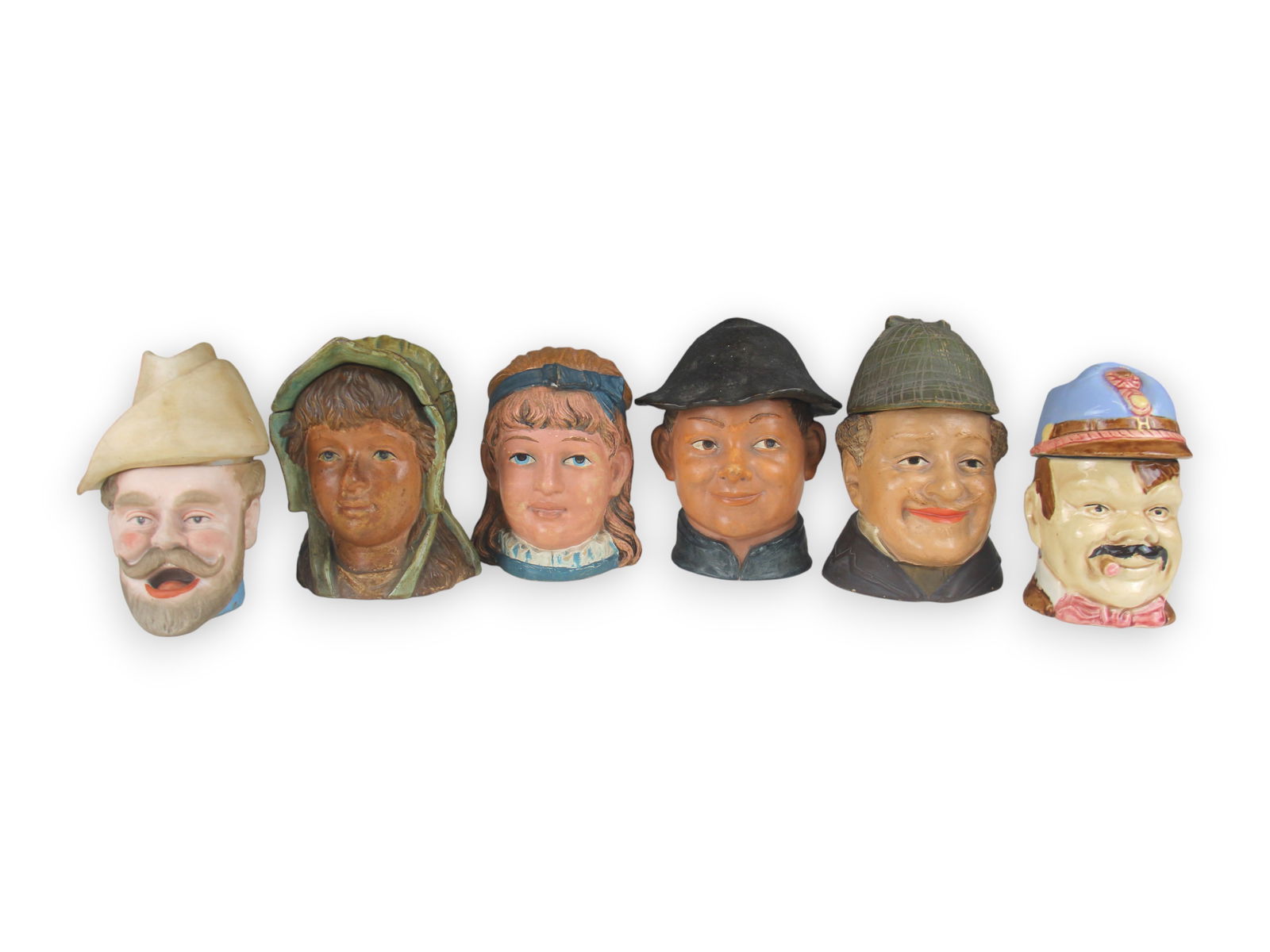 (6) Figural Head Tobacco Jars: 5 1/2-6 1/2" tall each. Some wear. See images for details. Shipping: Weiss Auctions offers full-service, in-house shipping for nearly all items in this auction. For a shipping quote, please contact us