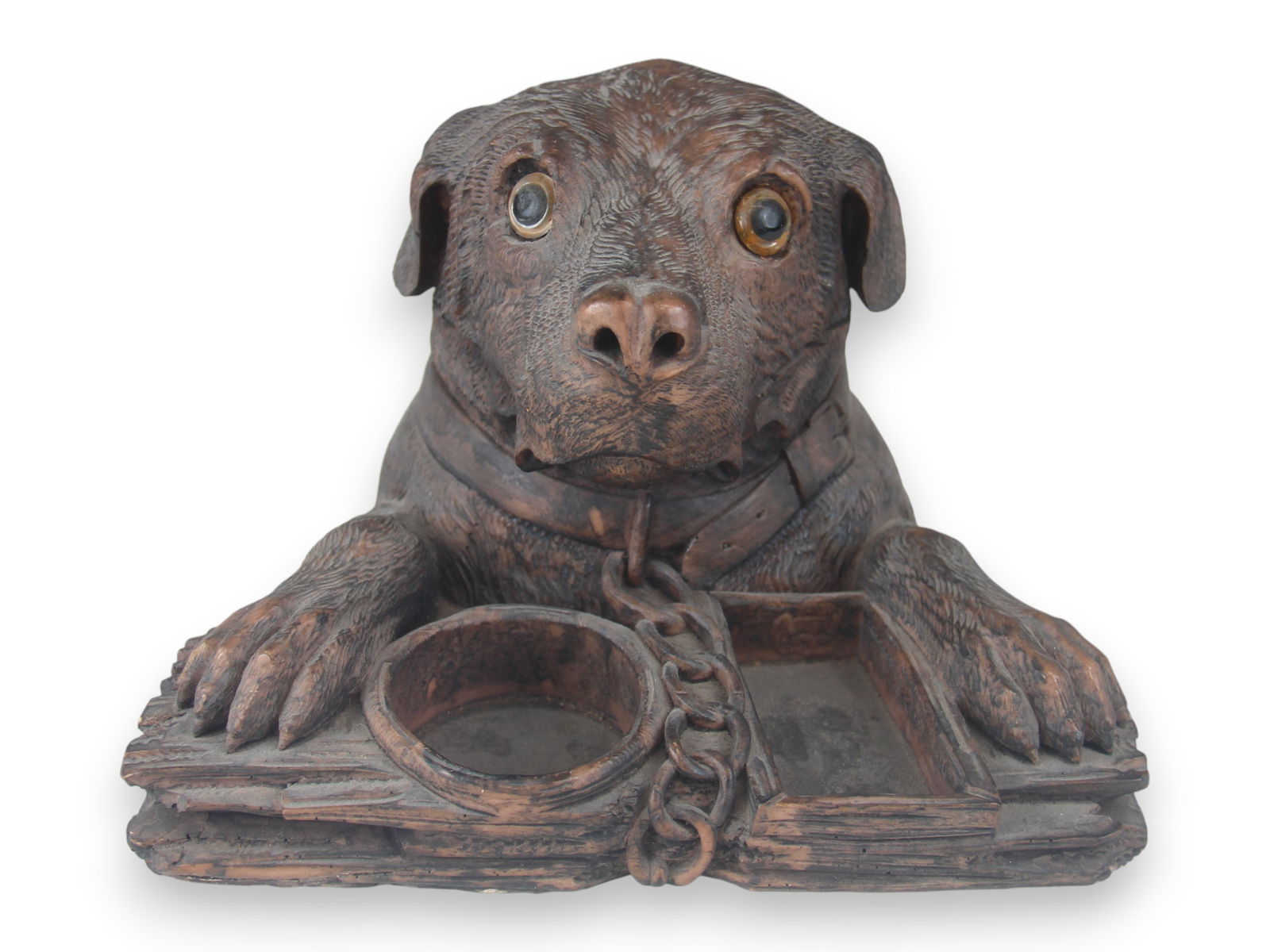 Black Forest Style Dog Tobacco Jar: Glass eyes and hinged head. 6" tall and 9 1/2" across. Shipping: Weiss Auctions offers full-service, in-house shipping for nearly all items in this auction. For a shipping quote, please contact us pri