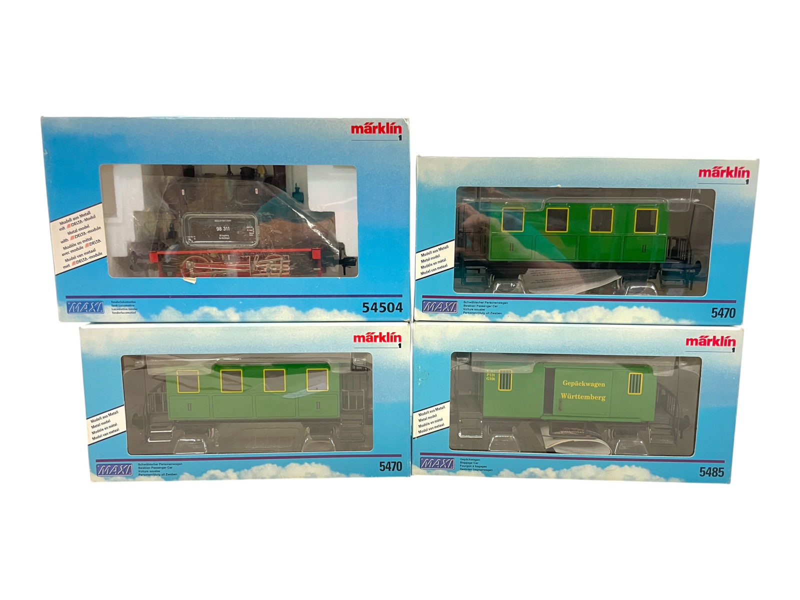 4pc Marklin Maxi Passenger Set: 1/G Gauge. Enamel Painted Pressed Steel. Includes a 54504 Steam Tank Loco; 2 - 5470 Coaches; 5485 Baggage Car, all show light use with boxes. Shipping: Weiss Auctions offers full-service, in-house shi