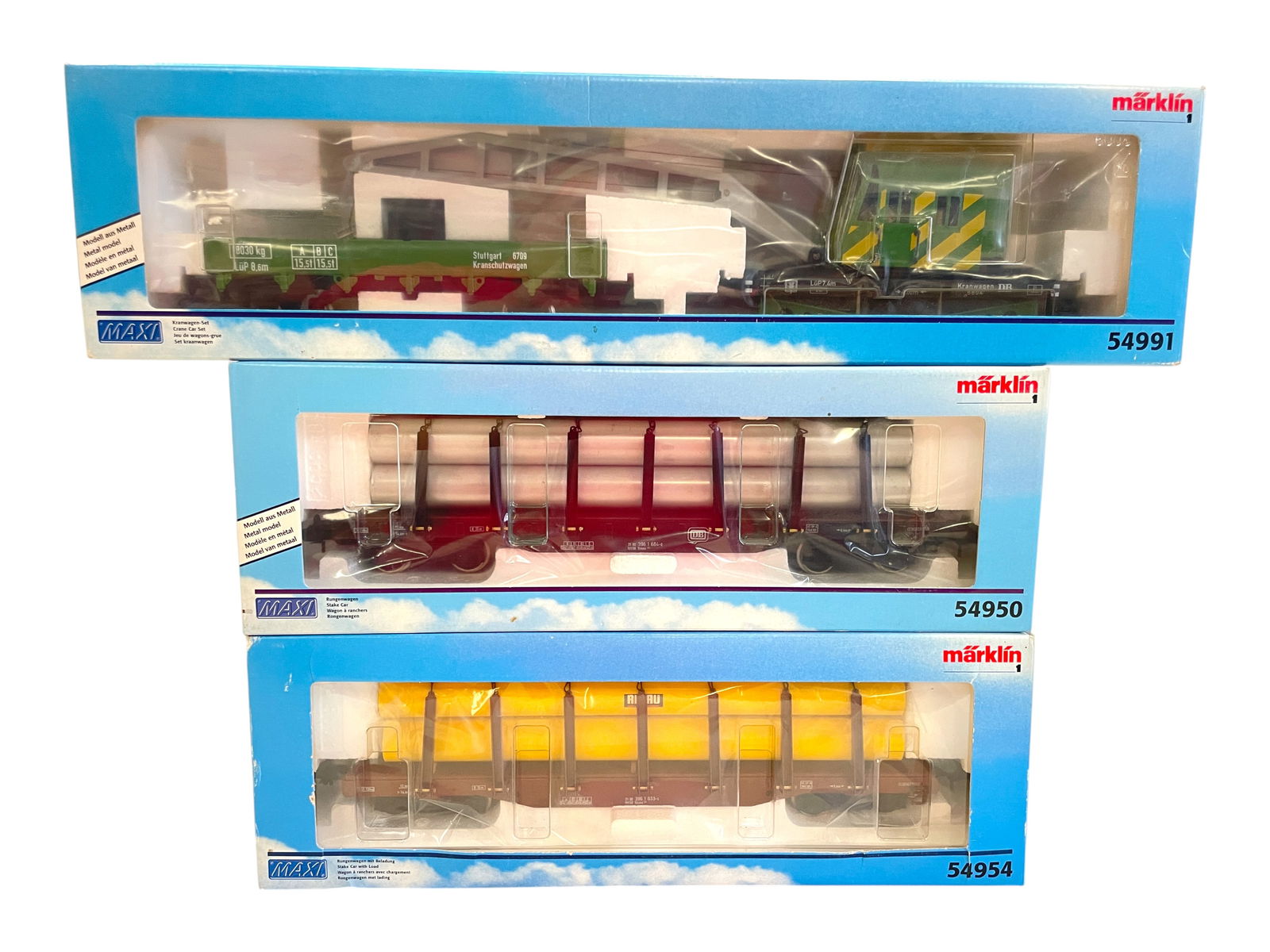 3 Marklin Maxi Freight Cars/Sets: 1/G Gauge. Includes a 54954 Boggy Truck Lumber Car; 54991 Crane and Boom Tender set; 54950 Boggy Truck Pipe flat. All show light use with boxes.Shipping: Weiss Auctions offers full-service, in-house