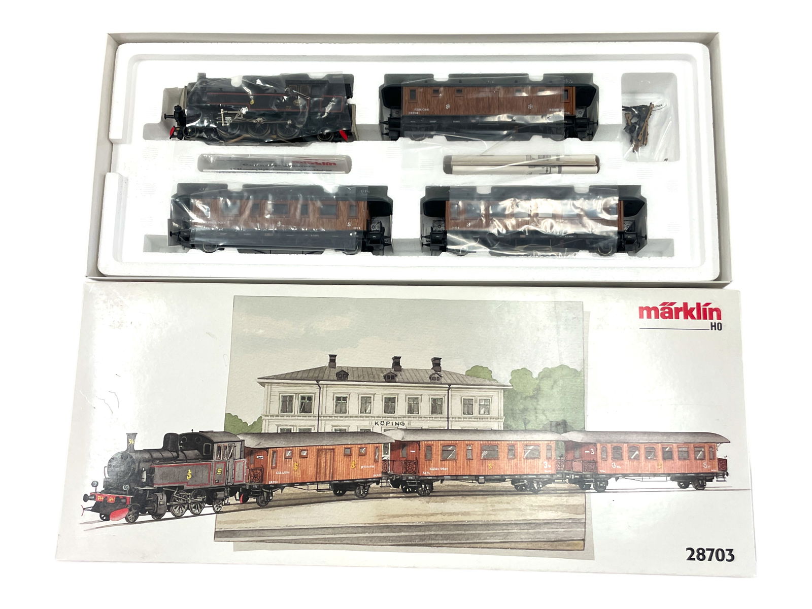 Unusual Marklin HO 28703 Swedish Teakwood Set: HO Gauge. Nice 2-6-2 Steam Tank loco with 3 real teak wood sided passenger cars. It shows light run time with set box. Shipping: Weiss Auctions offers full-service, in-house shipping for nearly all it