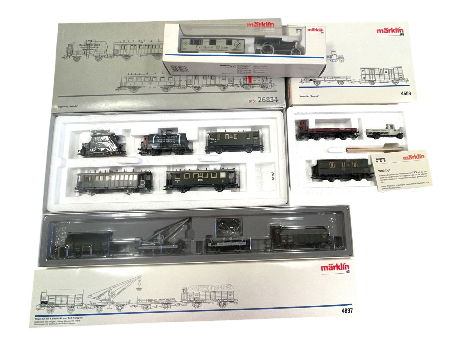 4pc Epoch 1 Digital Train Set: HO Gauge. Includes a 26834 Walhalla Passenger Set w/Mfx controls; 4897 4pc Maintenance Car set; 1883 Weiss Construction set; 4509 Bauzug 3pc set. All show light use with boxes.Shipping: Weiss
