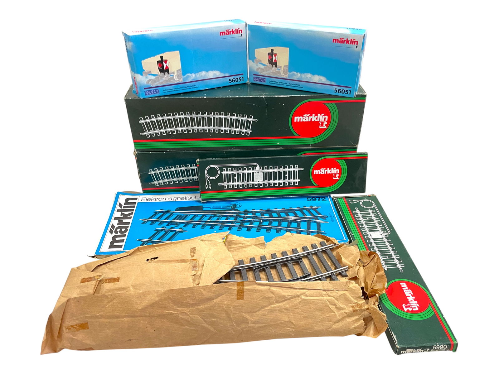 10pc Marklin Maxi Wide Radius Track Lot: 1/G Gauge. Includes3- 5972 LH remote switches, 1 ob worn; 2 boxed- 5932 - 10X 22 deg curve tracks; 2 boxed 5990 Feeder Tracks; 2 boxed 56051 Switch indicators; NO PHOTO 59033 Box of 36" Straights in