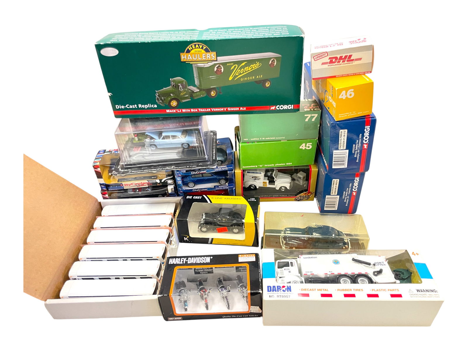 20+ Layout Vehicles: Includes Corgi, K-Line, CityCruisers, Rios and others, all new in boxes, plus a 6-pack of NYC City Transit Busses. Shipping: Weiss Auctions offers full-service, in-house shipping for nearly all items