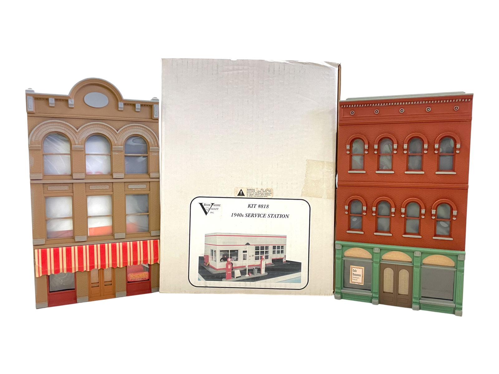 Layout Accessory Lot: Includes a Berkshire Valley 818-4 1940s service station model kit; 2 wood and resin 3-story apartment buildings with lower store fronts, one includes die cast vehicle; 30 Scenic Express Girder Bridge