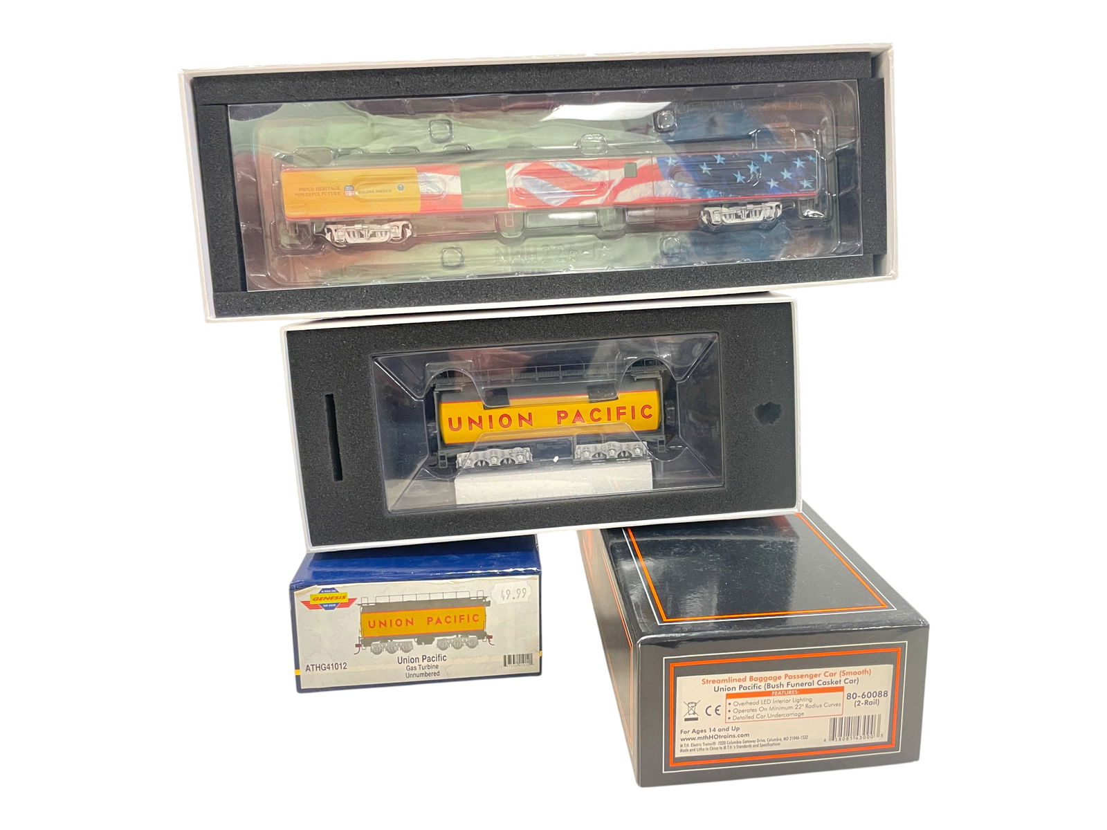 2pc Modern HO Train Lot: HO Gauge. Includes an MTH 80-60088 2-rail UP Smooth Baggage Car(Bush Funeral Casket Car); Genesis ATHG41012 UP Auxiliary Turbine Tender. Both appear new in boxes. Shipping: Weiss Auctions offers full-