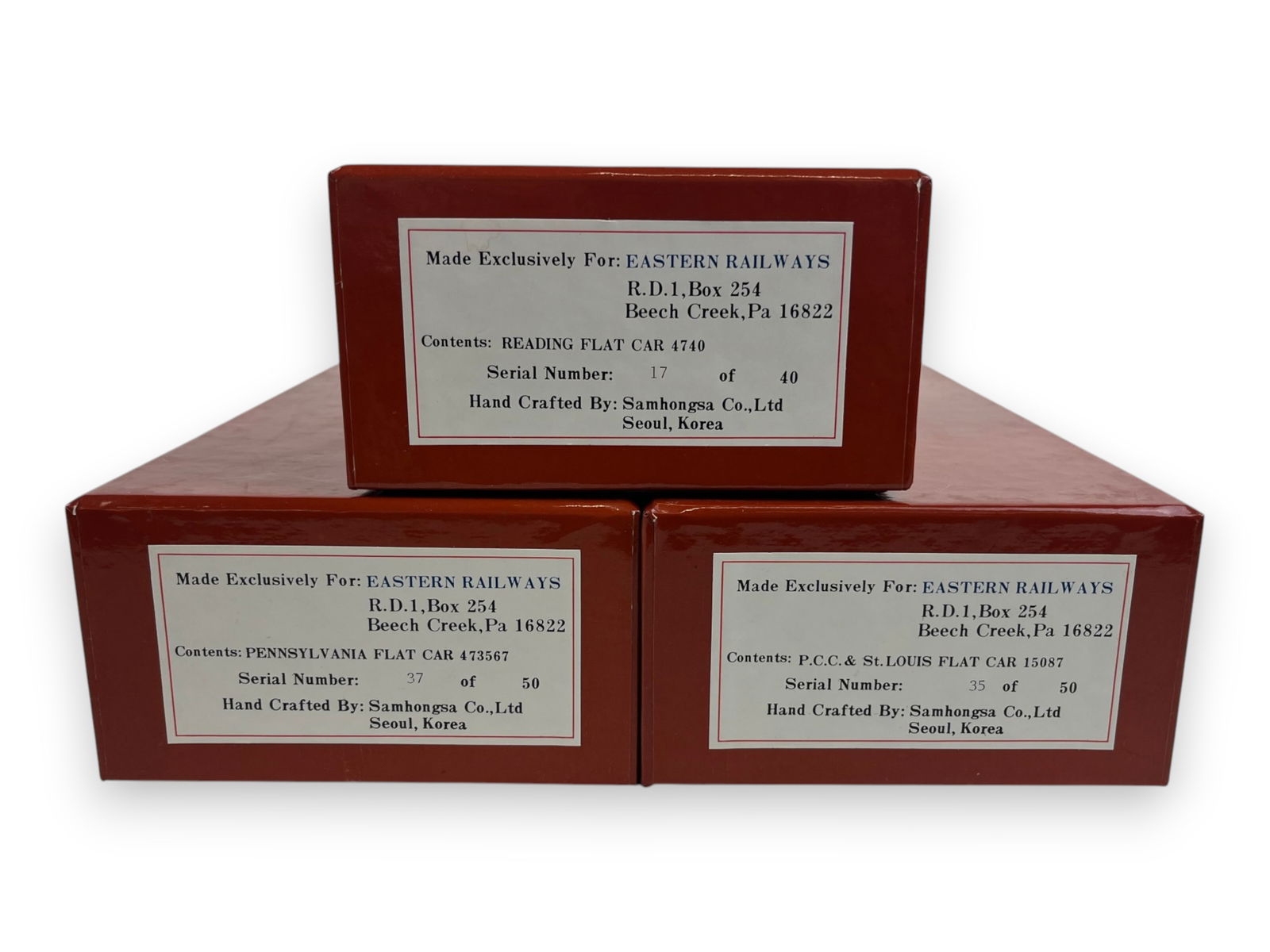 (3) Samhongsa Gauge 1 Brass Flat Cars: For Eastern Railways. Includes Reading Flat 17/40 #4740; PCC & St Louis Flat 35/50 #15087; PRR Flat 37/50 #473567. All includes brass stakes. Super detailed factory painted brass, new in