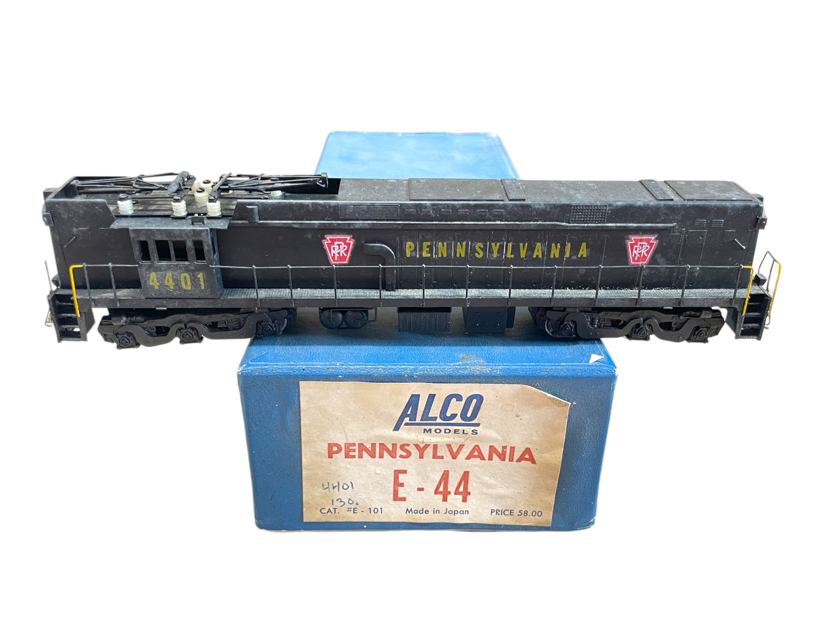Alco Brass HO PRR E44 Electric: HO Gauge. Nicely custom painted example with open frame motor. Pantographs are intact and cab decals 4401. It would benefit from a cleaning and shows light use with box, no foam. Shipping: Weiss Aucti