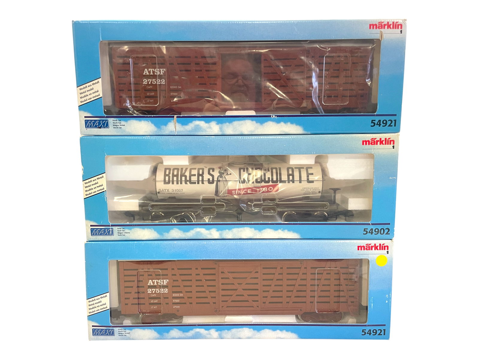 3 Marklin Maxi US Freight Cars: 1/G Gauge. Includes a 54902 Baker's Chocolate tank car; 2-54921 ATSF Stock Cars. All appear test run with lightly shop worn boxes.Shipping: Weiss Auctions offers full-service, in-house shipping for