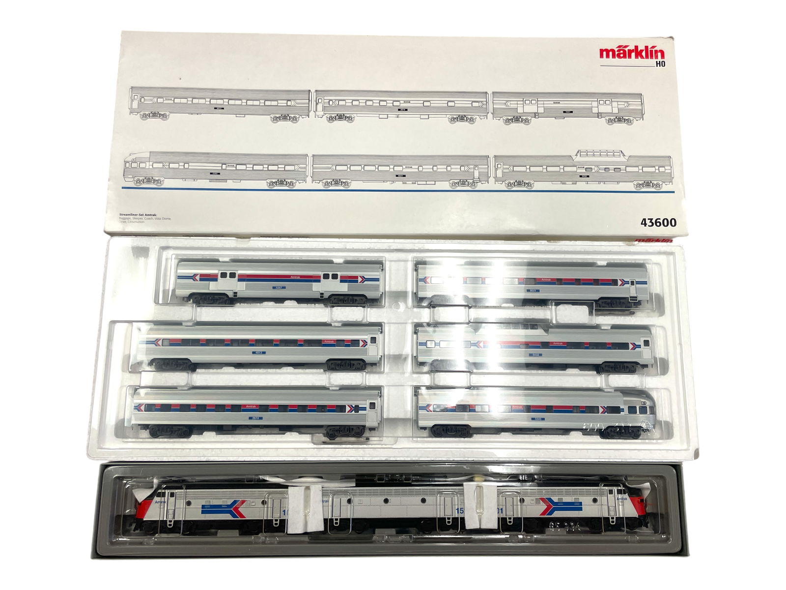 Marklin HO American Amtrak Passenger Set: HO Gauge. Includes a digital 37621 Amtrak F7 ABA all powered and tethered; 43600 6 extruded passenger car set. All appear like new with boxes. Shipping: Weiss Auctions offers full-service, in-house sh