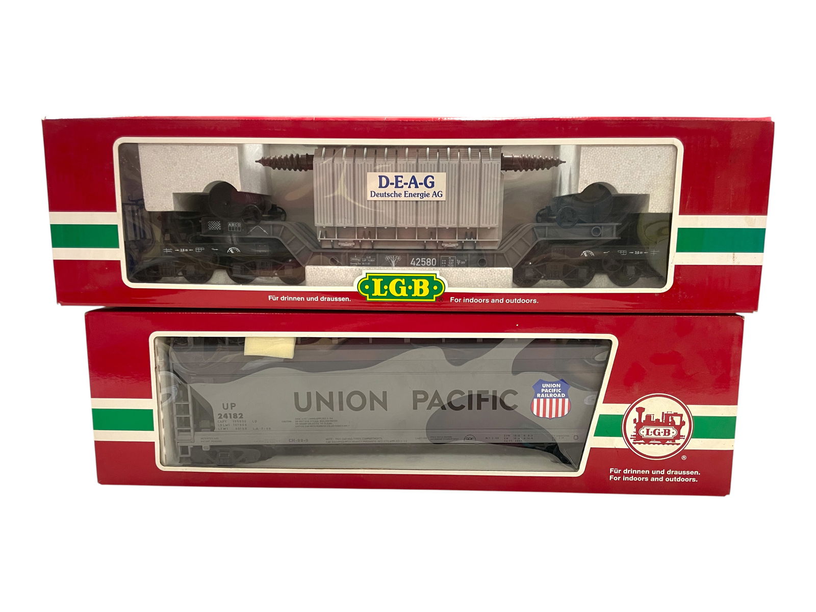 2 LGB Large Freight Cars: 1/G Gauge. 41820 UP center Flow Hopper; 41580 DEAG Heavy Lift Flat with DEAG Transformer. They show light use with boxes, 41580 is over written.Shipping: Weiss Auctions offers full-service, in-house