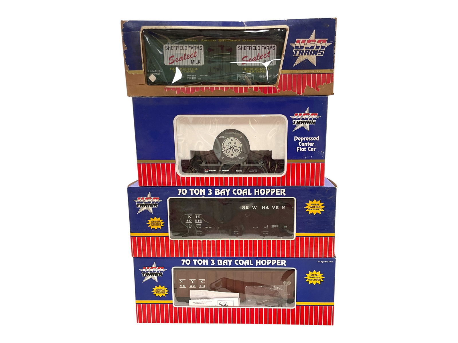 4 USA Freight Cars: 1/G Gauge. Includes R14010 NH Coal Hopper; 16038 Sheffield Farms Reefer ob rough; R14009 NYC Coal Hopper; R17317 NH Reel Car. They show light use, rest have nice boxes.Shipping: Weiss Auctions offers