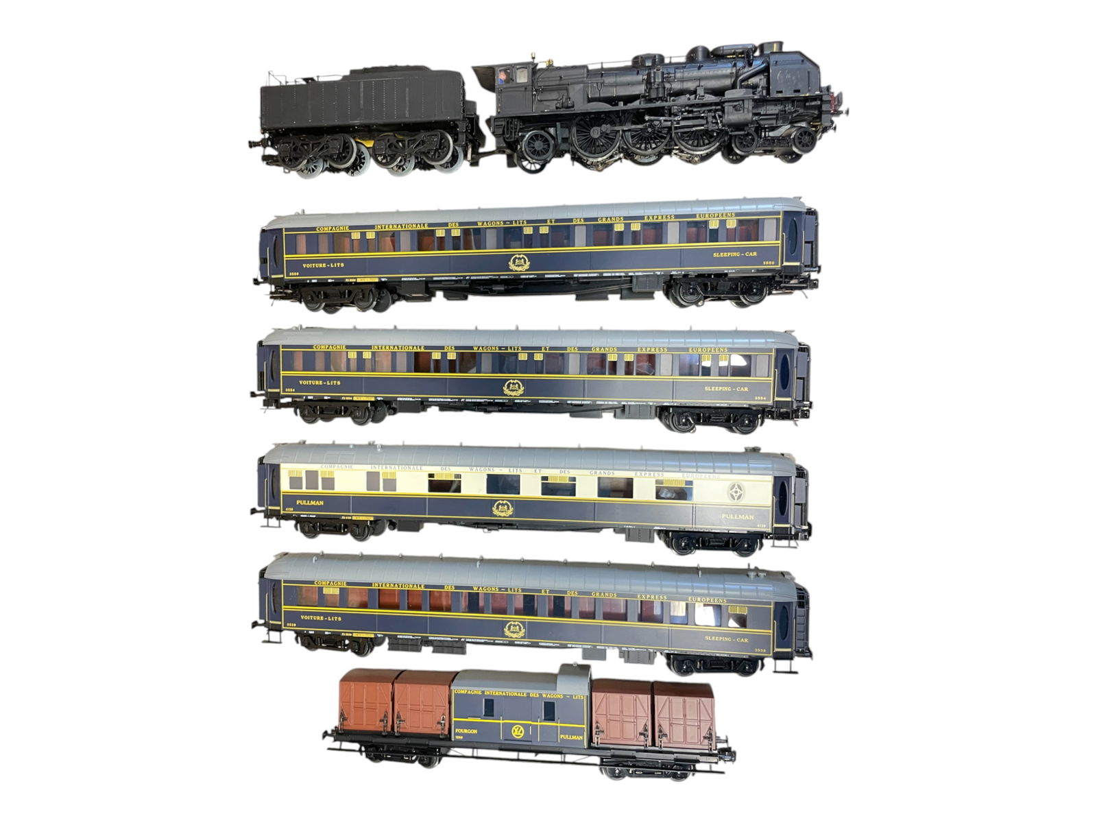 6pc MTH Orient Express Set, TLC: 072. Includes a REPAINTED 20-3343-1 SNCF Chapelon 231E Pacific equipped with PS2 with Hi Rail Wheels; 20-60004 Orient Express cars, one missing one top vent; Container car. Rest show light play wear.