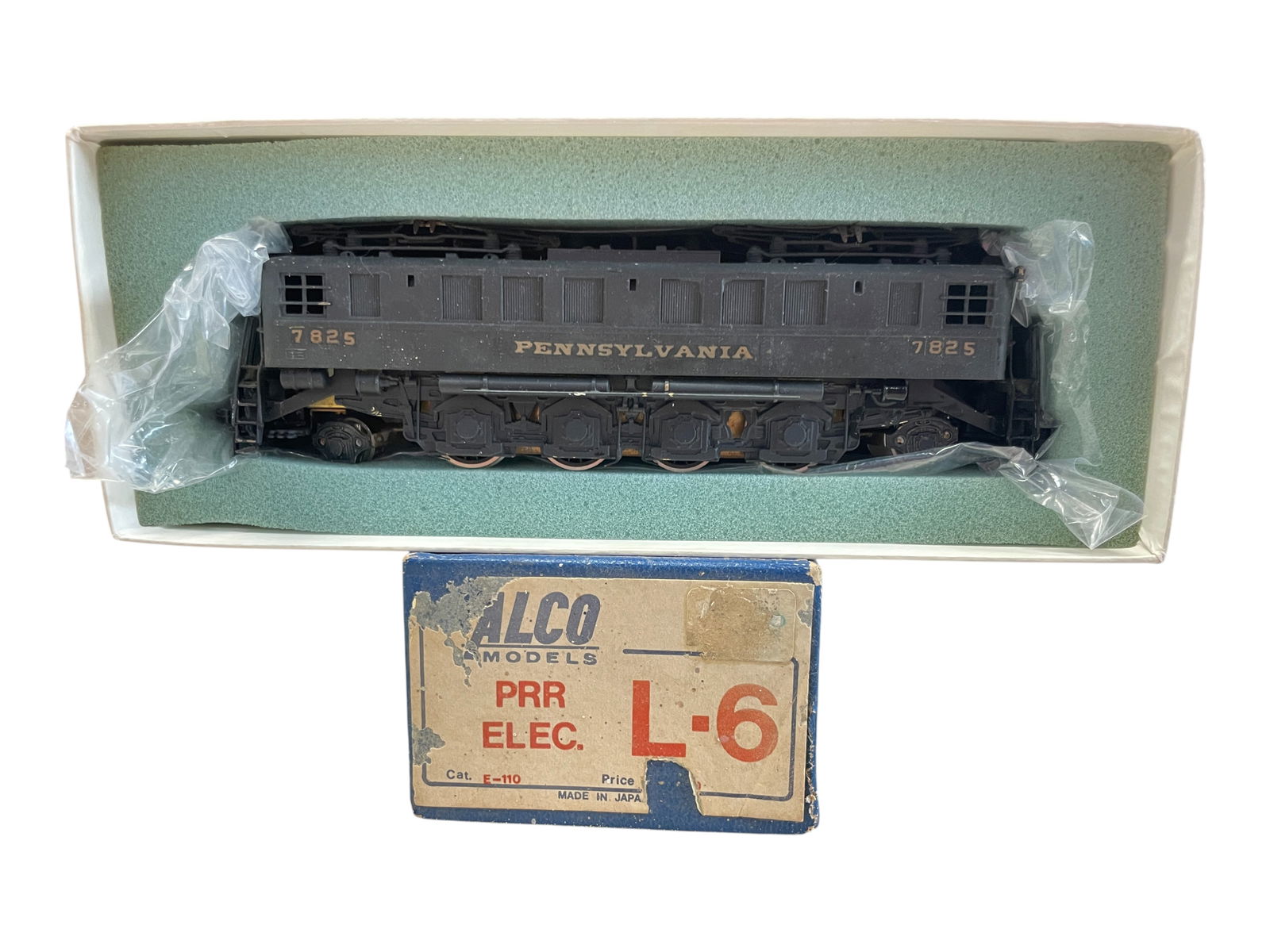 Alco Brass HO PRR L6 Electric: HO Gauge. Nice custom painted 2-8-2 box cab electric #7825. It has an open frame motor and would benefit from a cleaning. It shows light use with box.Shipping: Weiss Auctions offers full-service,