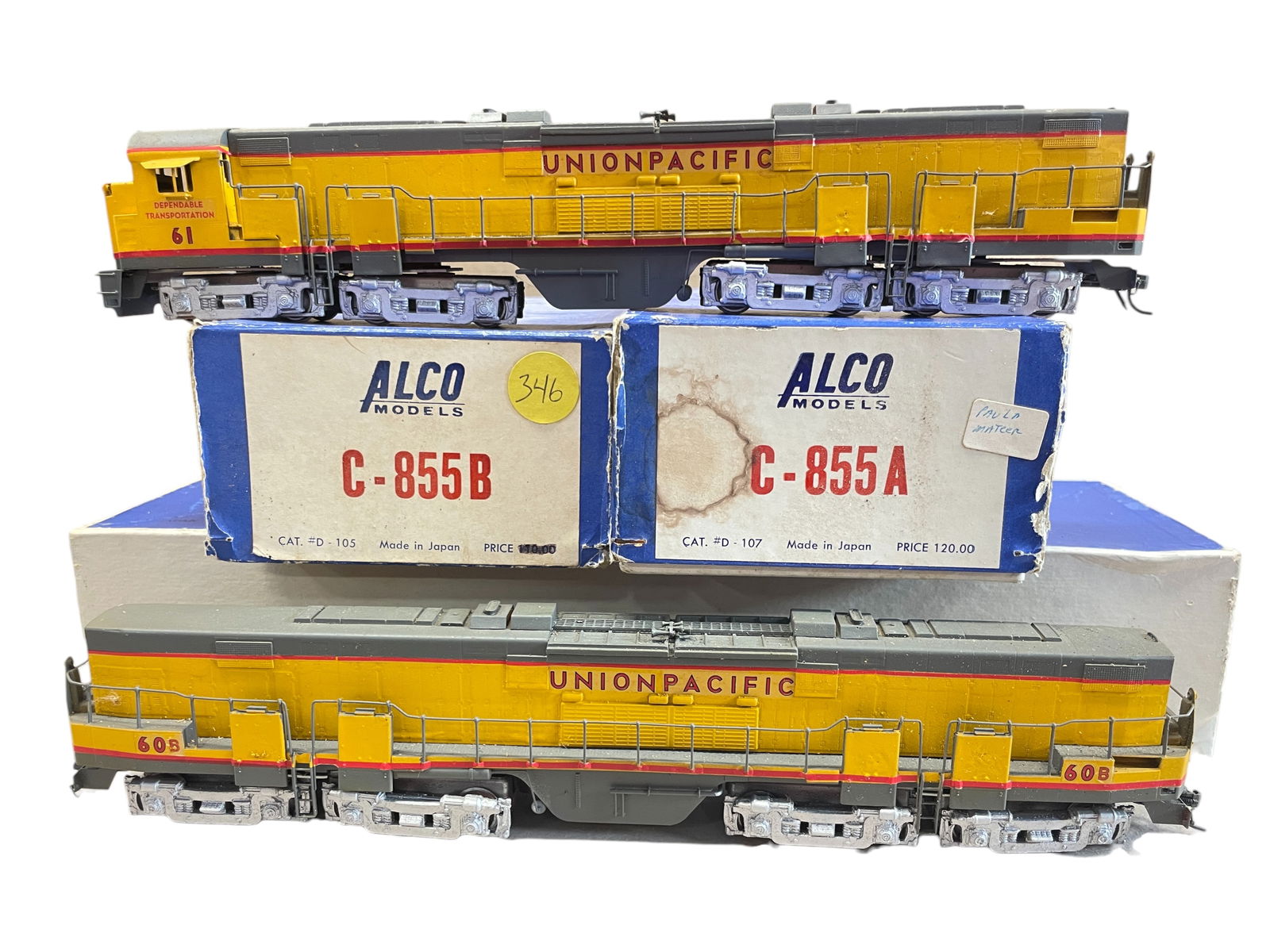 Huge Alco Brass UP C-855A & B Diesels: HO Gauge. Nice custom painted brass #'d 61 & 60b. Both are open frame motor, 16-wheel drive and show light use with boxes, no foam.Shipping: Weiss Auctions offers full-service, in-house shipping for