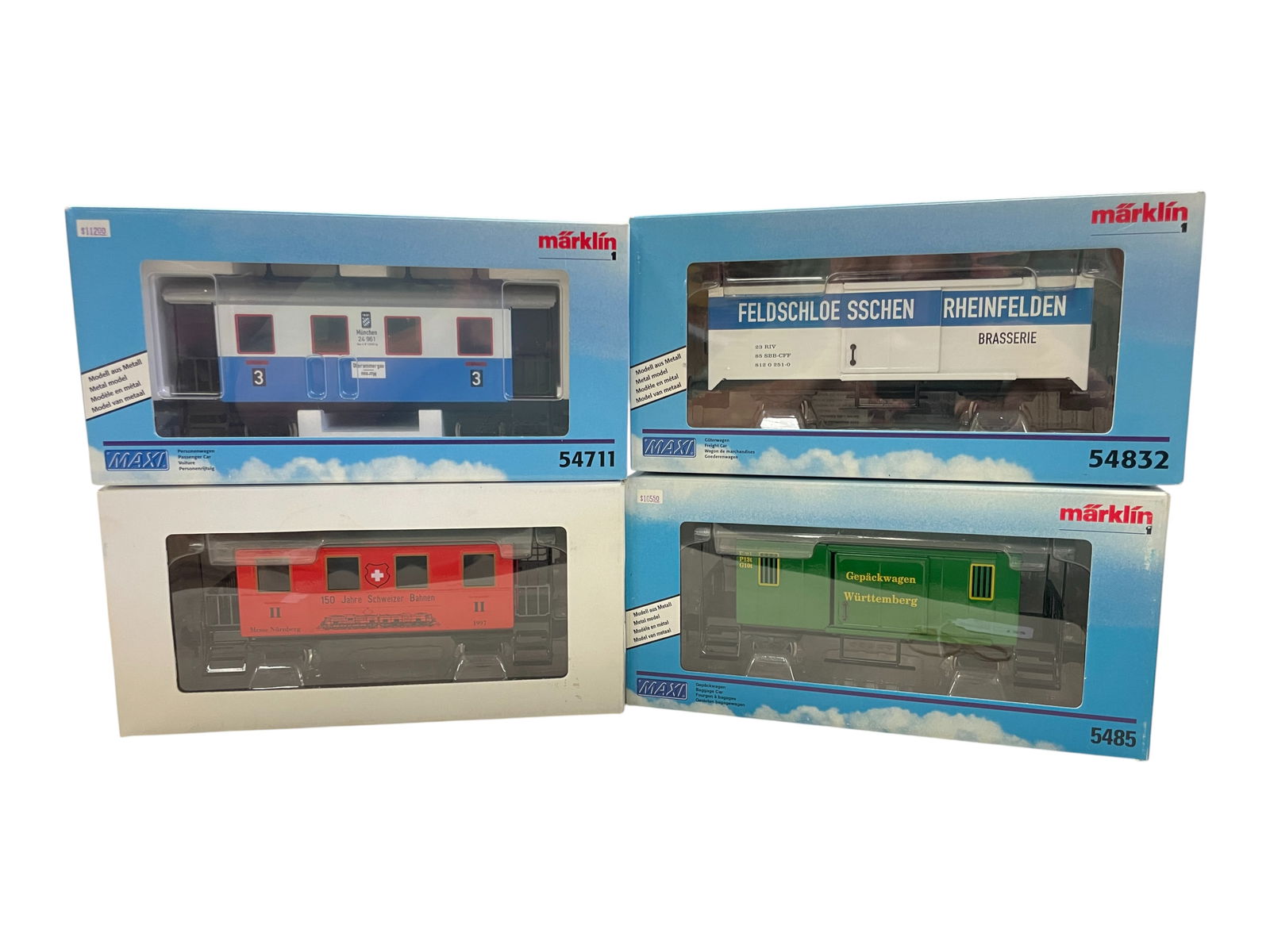 4 Marklin Maxi Passenger & Freight Cars: G/1 Gauge. Includes 150 Commemorative Coach; 5411 3rd Clss coach; 5485 Baggage Car; 54832 Reefer. All appear new in boxes. Shipping: Weiss Auctions offers full-service, in-house shipping for nearly al