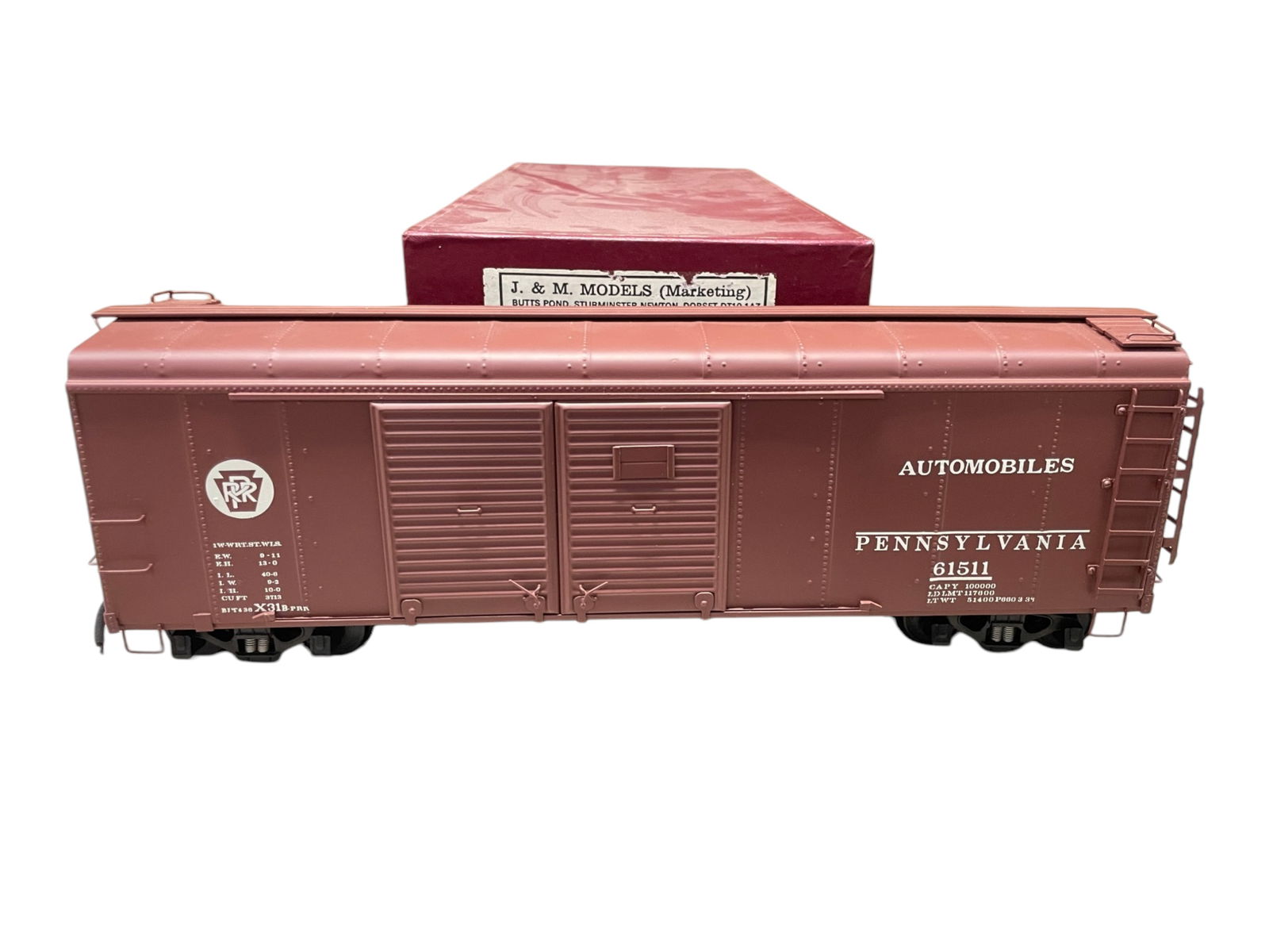 J&M Gauge 1 Brass PRR Boxcar: 1/G gauge. Nicely detailed 40' round roof auto box car. #61511. It is factory painted brass, LN in box.Shipping: Weiss Auctions offers full-service, in-house shipping for nearly all items in this