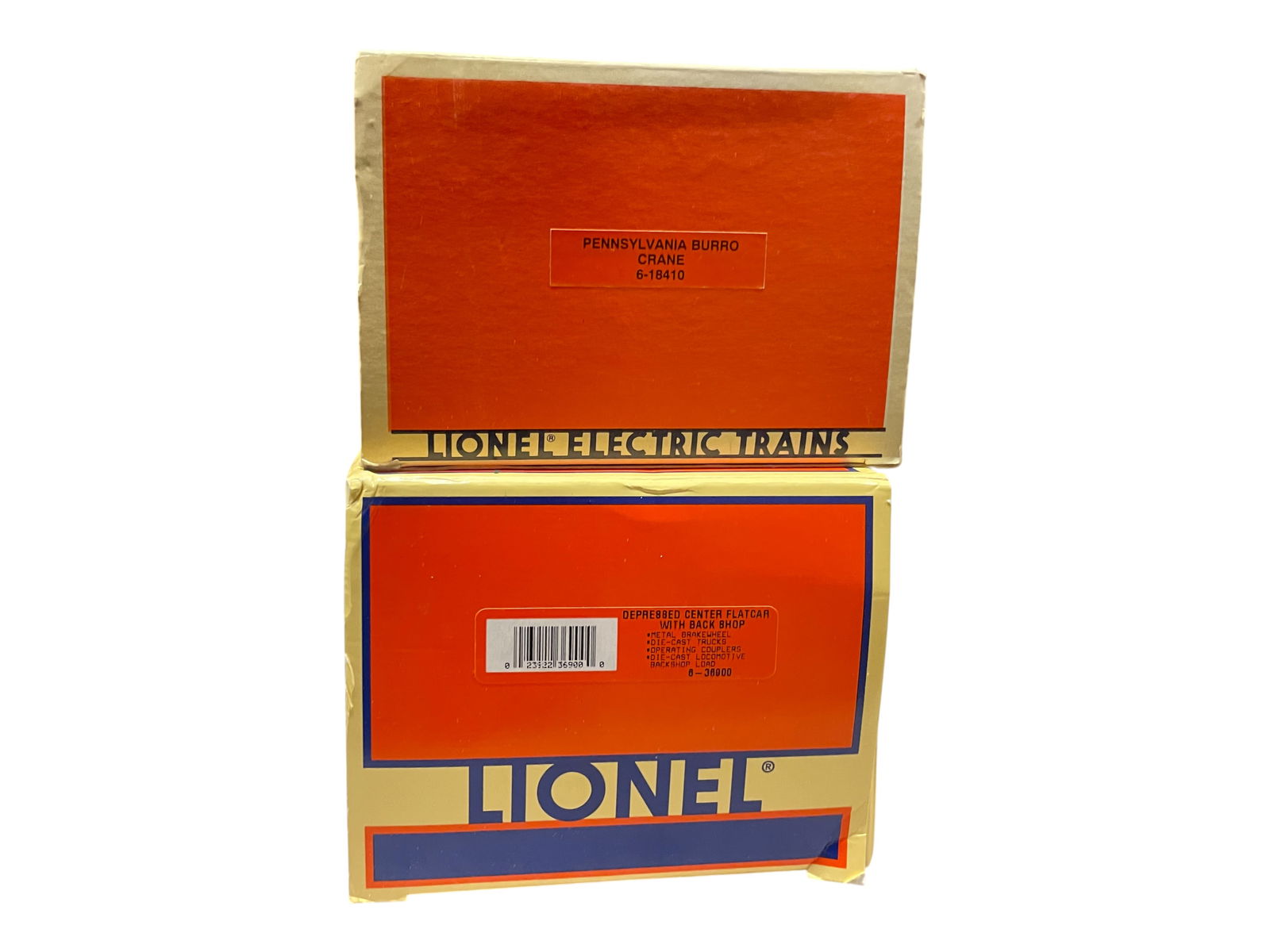 Lionel Modern Burro Crane And Back Shop: Includes an 18410 PRR Burro Crane; 36900 Depressed Center Flat with Back shop. They show light use with boxes Shipping: Weiss Auctions offers full-service, in-house shipping for nearly all items in th