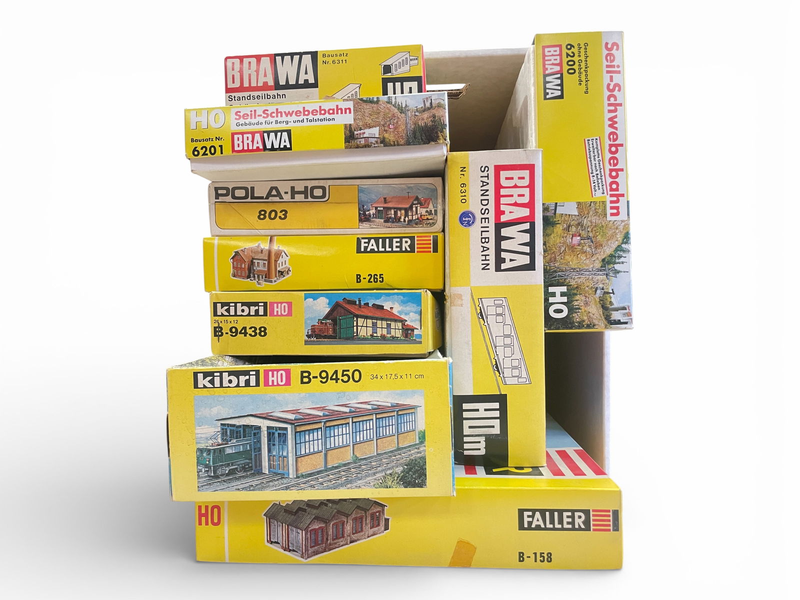 8 Vintage German HO Accessories: HO Gauge. Includes Brawa 6310 Incline Railroad set; Brawa 6200, 6201 & 6311 Cale Car pieces; Faller B158 1900s engine shed; Faller B265 Factory; Kibri B9540 Modern Engine Shed; B9438 Mid period Engine