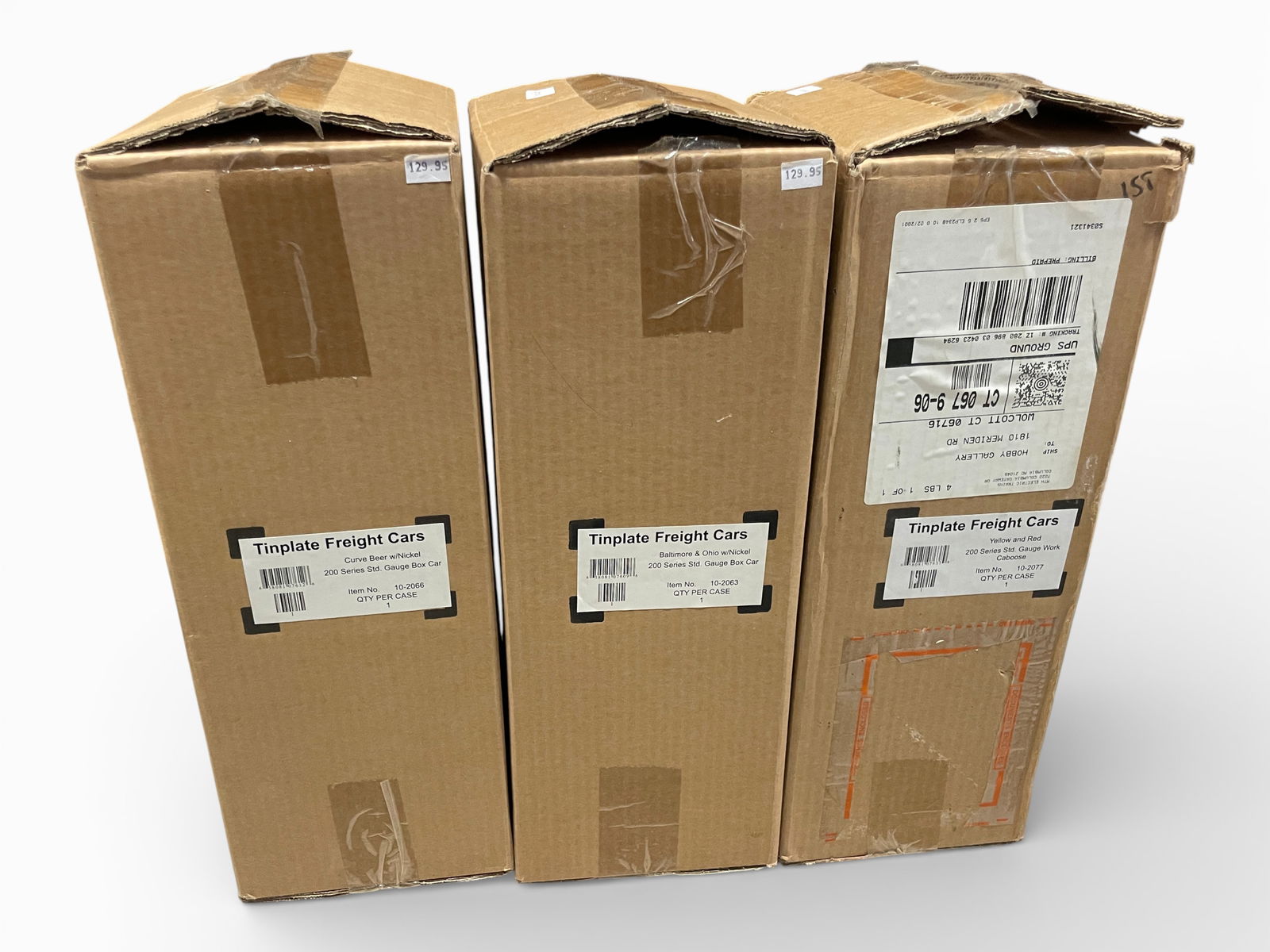 3 MTH Tinplate Freight Cars: Standard Gauge. Includes 10-2066 Curve Beer Boxcar; 10-2063 B&O Boxcar; 10-2077 Yellow & Red Work Caboose. They are near sealed in shippers.Shipping: Weiss Auctions offers full-service, in-house