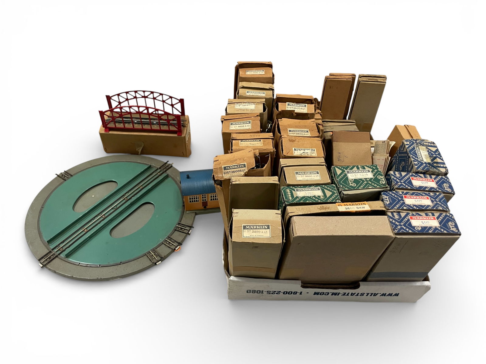 Large Lot Early Marklin HO Track & Accessories: HO Gauge. Includes a 410M Turntable; Many boxes of track, most solid 3-rail, switches, signals, power tracks; Tin Bridge; Transformer and more. Examine photos, all is included. Heavy lot, so watch