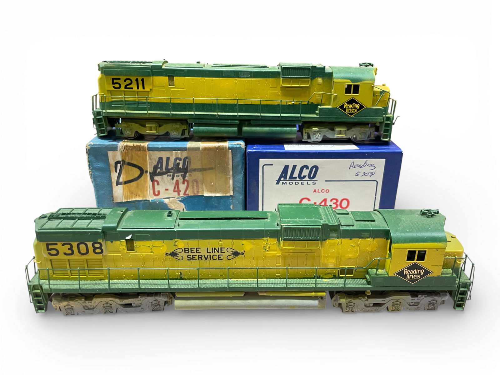 2 Alco Brass HO Reading Diesels: HO Gauge. Includes a C4209 Low Hood Diesel #52112; C-430 Low Hood #5308. Both have open frame motors with fair level paint jobs. Both have boxes, no foam.Shipping: Weiss Auctions offers full-service,