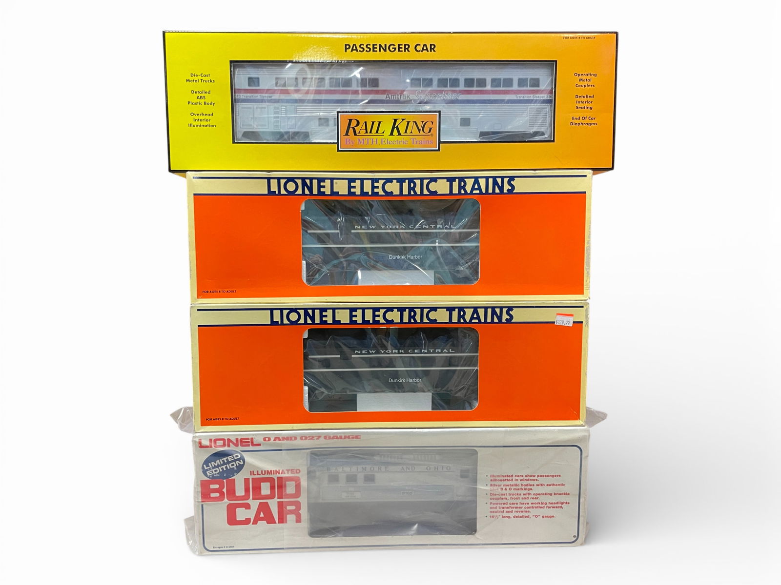 Assorted Modern Passenger Cars: Includes an MTH 30-6503 Amtrak Sleeper; Sealed 8765 BUDD NON-Powered Baggage; two 19137 NYC Roomette. All appear new in boxes.Shipping: Weiss Auctions offers full-service, in-house shipping for