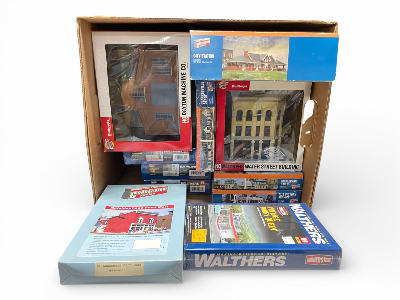 11 Walthers Cornerstone Structures: HO Gauge. Includes 2 built-ups, all the rest are unbuilt kits. All appear new in boxes. Examine photos for exact lot inventory.Shipping: Weiss Auctions offers full-service, in-house shipping for