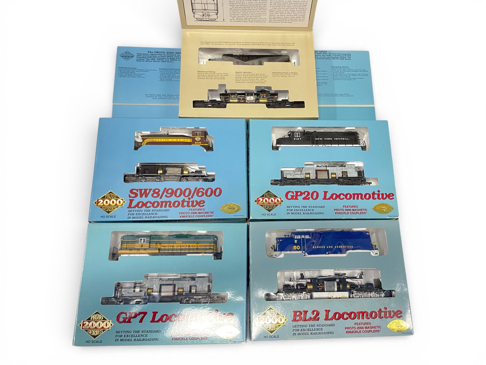 5 Proto 2000 Diesels: HO Gauge. Includes 23005 MEC GP7 #566; 30 NYC GP20 #6107; 30083 B&M SW8 #806; 30190 B&A BL2 #50; 8698 BL2 undecorated. All appear new in boxes.Shipping: Weiss Auctions offers full-service, in-house