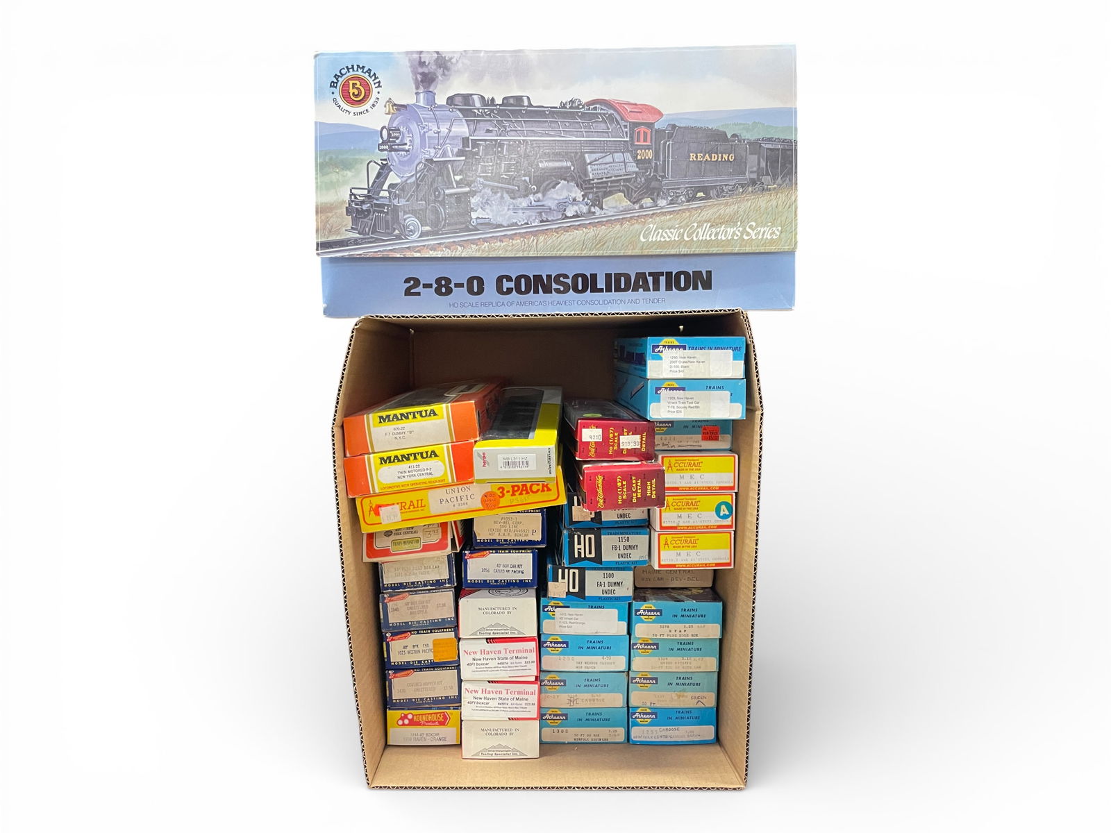36pc Assorted HO Trains Group: HO Gauge. Includes a Bachmann 2-8-0 Consolidation, ob; Mantua NYC F7 AB, obs; Athearn B&A SW8 custom painted, ob; the rest are kits, built-up kits and a couple of RTR cars. All in great condition with