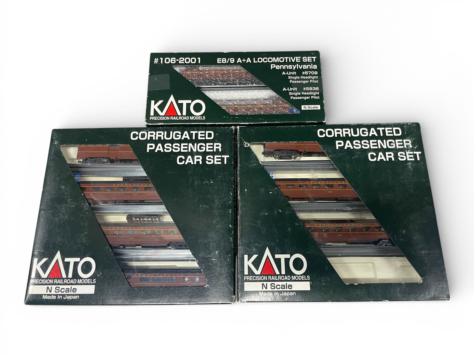 KATO PRR Passenger Set: N Gauge. Includes 106-2001 E8 AA Diesel #5836 with 106-1701 PRR-1 3cars, missing a sleeper; 106-1702 PRR -2. Most appear like new with boxes. Shipping: Weiss Auctions offers full-service, in-house shi