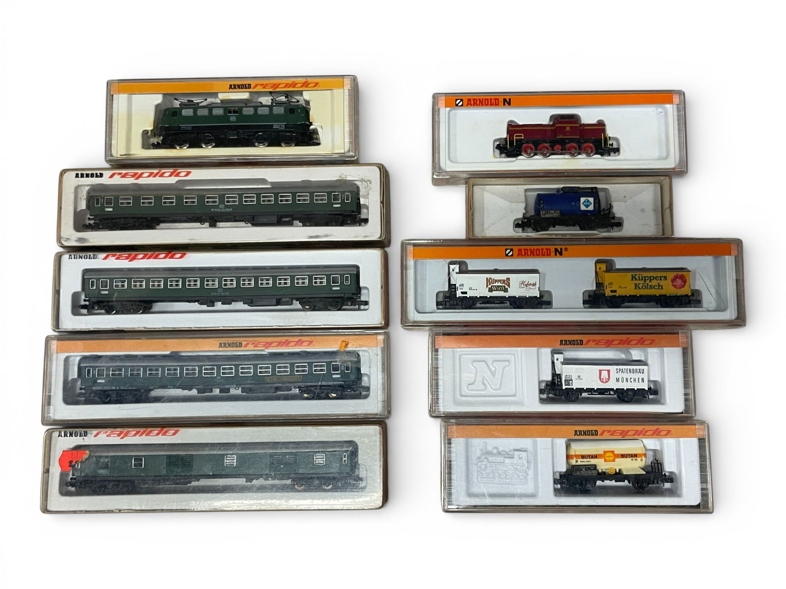 10pc Arnold Rapido Freight & Passenger Sets: N Gauge. Includes an 0234 BR30 BO-BO Electric; with 3221, 0322, 0323 & 0324 Express cars; 2016 DB V65 011 Diesel with goods cars- 0136, 1431; 0427 & 0451. All appear like new with boxes. Shipping: Wei