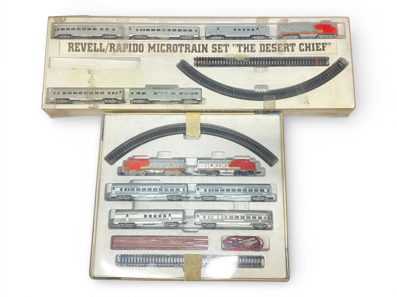 2 Arnold SF Passenger Sets: N Gauge. Includes a 1967-68 Arnold Rapido 079 FP AA Diesel set with 4 streamline cars, track and rerailer; Revell/Rapido The Dessert Chief set with SF FP A diesel with 5 streamline cars and track, mis