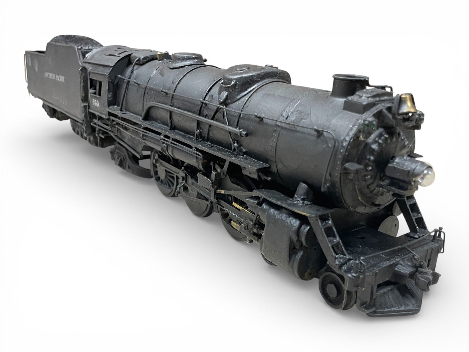 Lobaugh O Scale SP Pacific: 1940s, Custom painted bronze boiler nicely detailed 4-6-2. It was converted to 3-rail with wider flanged wheels. It has a headlight and marker jewels with Pittman motor. Road #650 with long haul