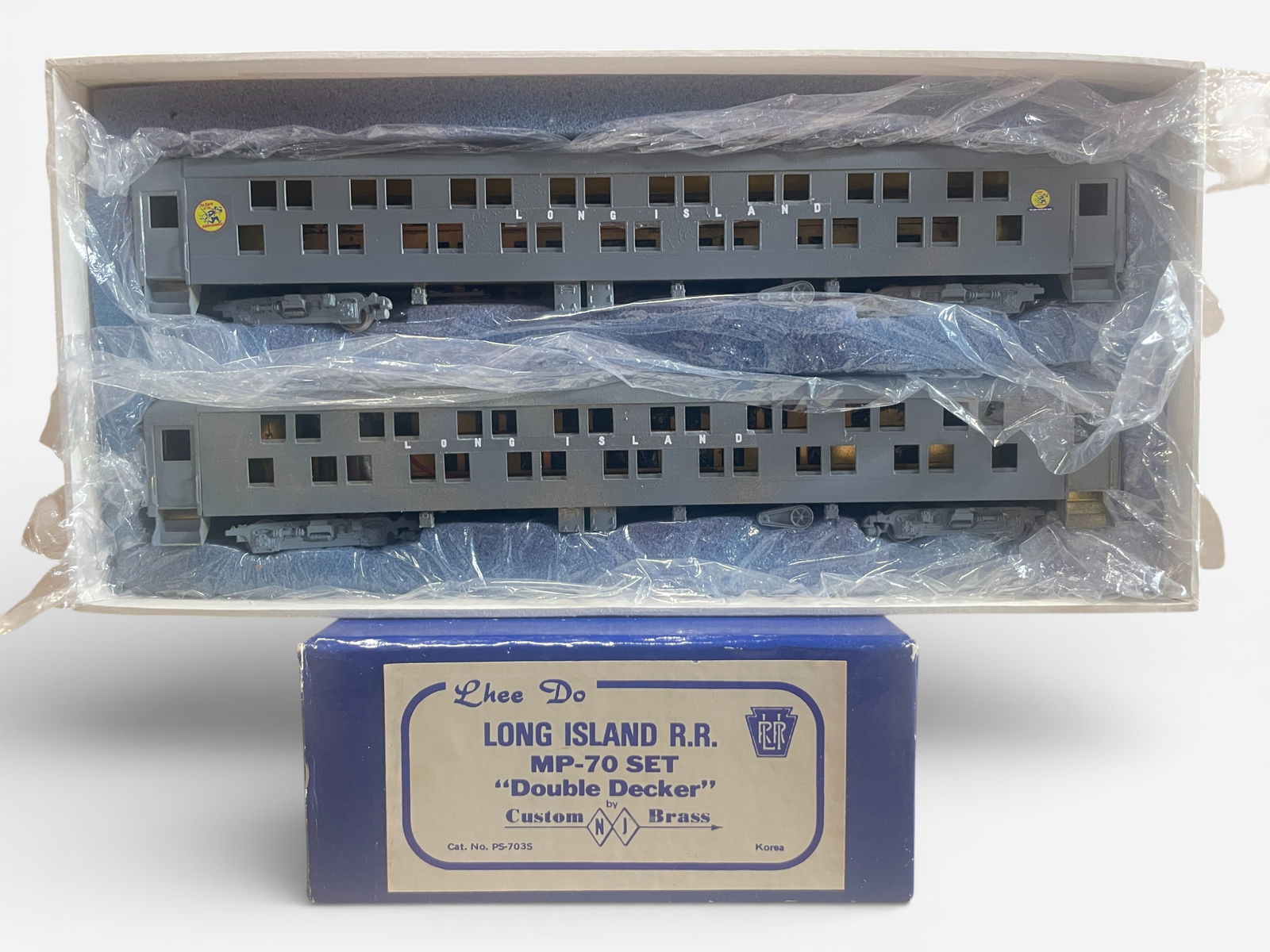 NJCB Brass LI MP-70 Double-Decker Car Set: HO Gauge. Nice custom, painted 2 car set, showing light use with nice box.Shipping: Weiss Auctions offers full-service, in-house shipping for nearly all items in this auction. For a shipping quote,