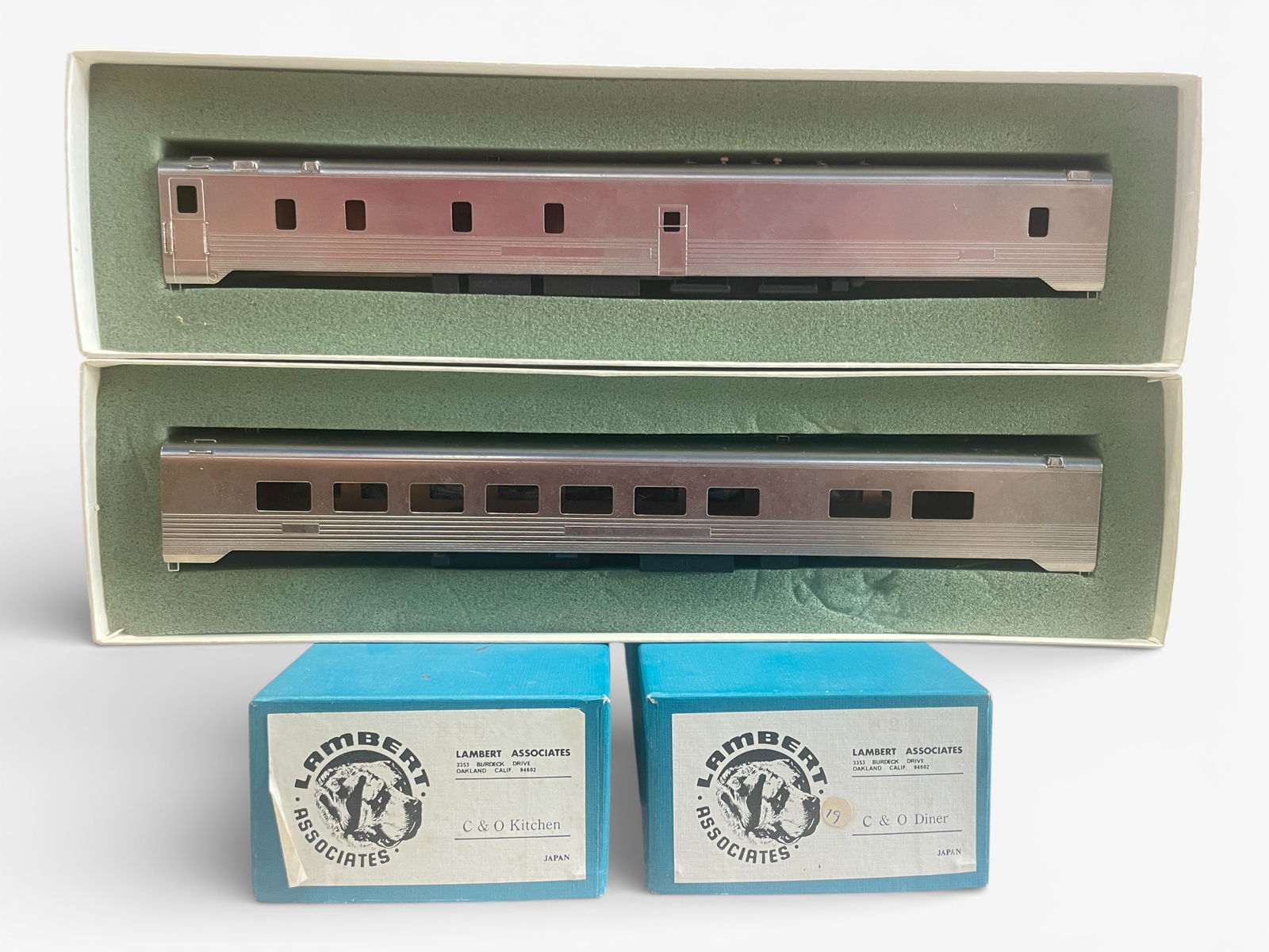 Lambert Brass HO C&O Kitchen & Diner Cars: HO Gauge. Nickel plated brass cars, factory painted undercarriages, NO trucks. They appear like new with boxes & foam. Shipping: Weiss Auctions offers full-service, in-house shipping for nearly all it