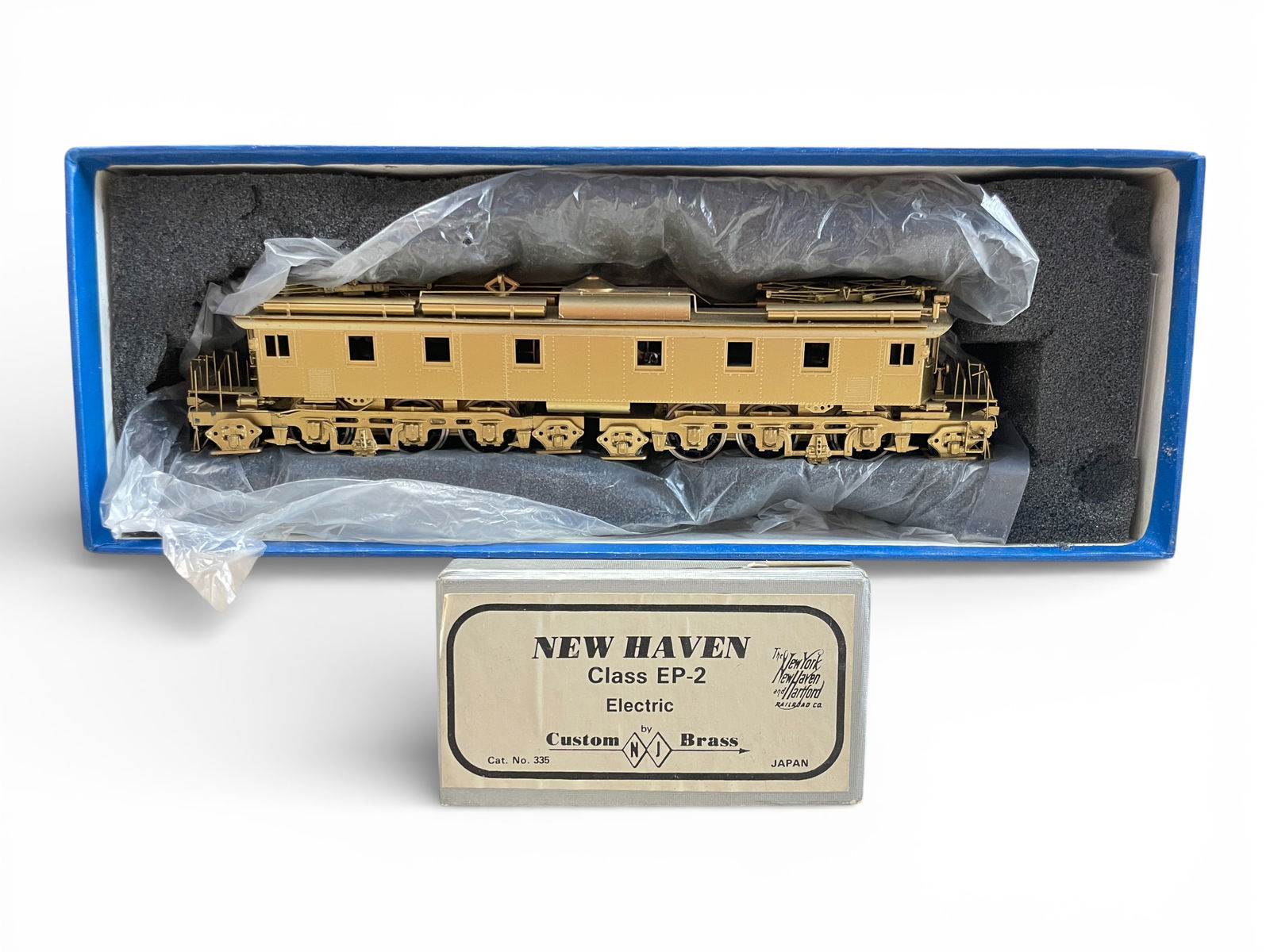 Alco Brass HO NH EP2 Electric: HO Gauge. Nice gold tone finished 2-6-2+2-6-2 Electric. It has great details and can motor. Appears like new with box, hard foam.Shipping: Weiss Auctions offers full-service, in-house shipping for